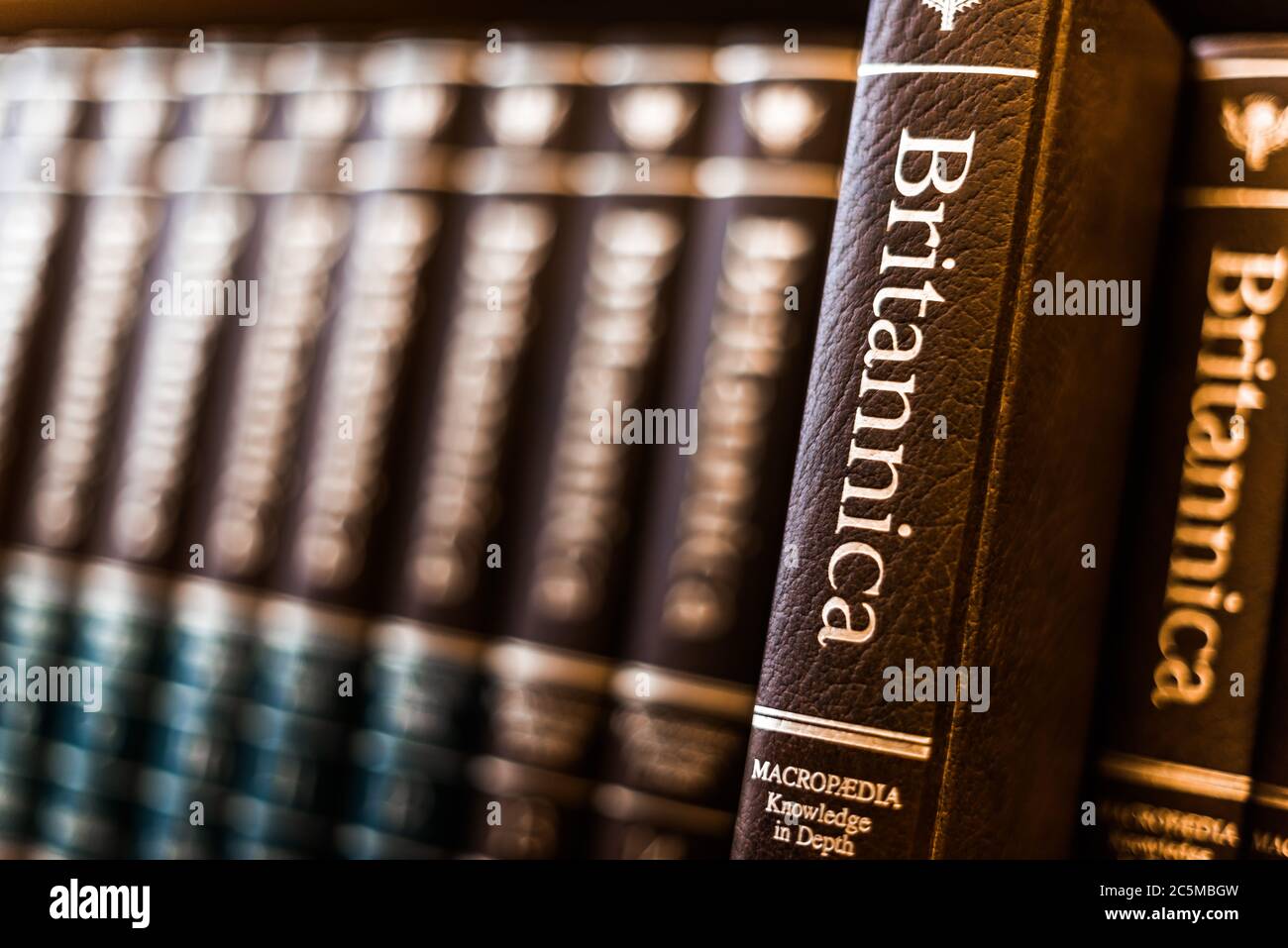 POZNAN, POL - FEB 03, 2020: Encyclopedia Britannica volumes on a shelf in a public library Stock Photo