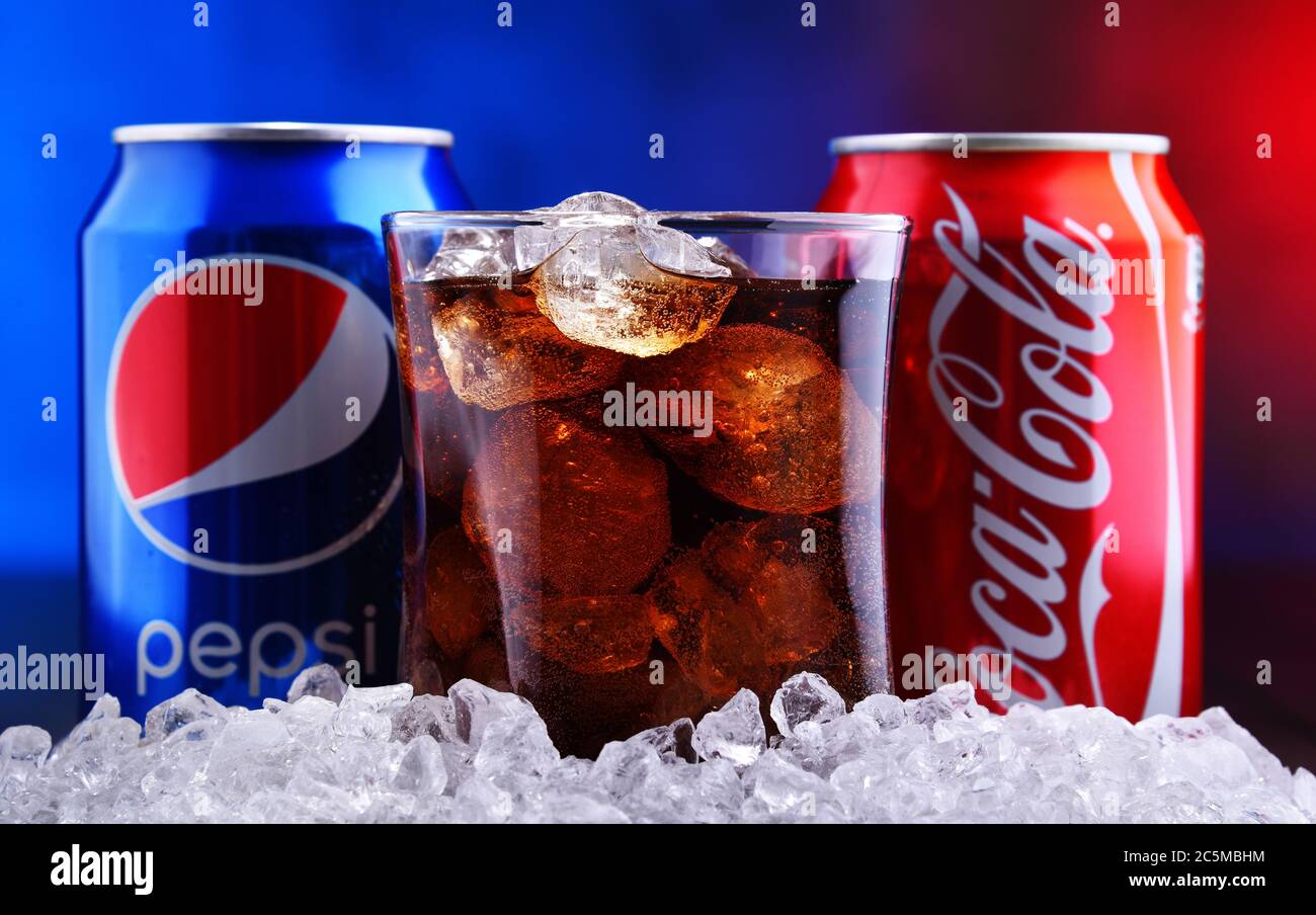 POZNAN, POL - FEB 13, 2020: Two cans of world's most popular soft drinks:  Coca Cola and Pepsi and the glass of drink with crushed ice Stock Photo -  Alamy