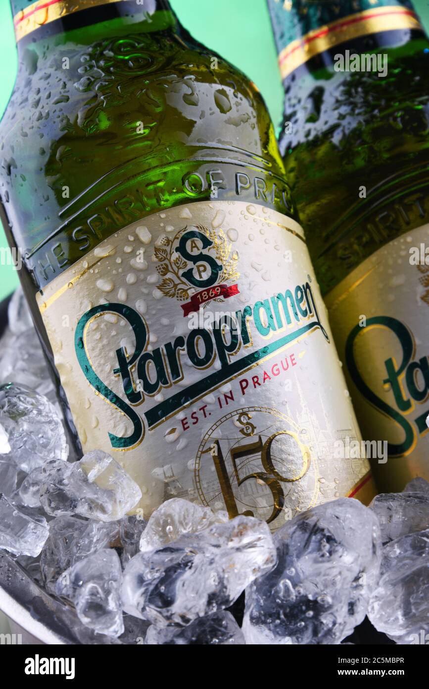 POZNAN, POL - APR 7, 2020: Bottles of Staropramen, the flagship product of Staropramen Brewery. The company owned by Molson Coors and located in Pragu Stock Photo