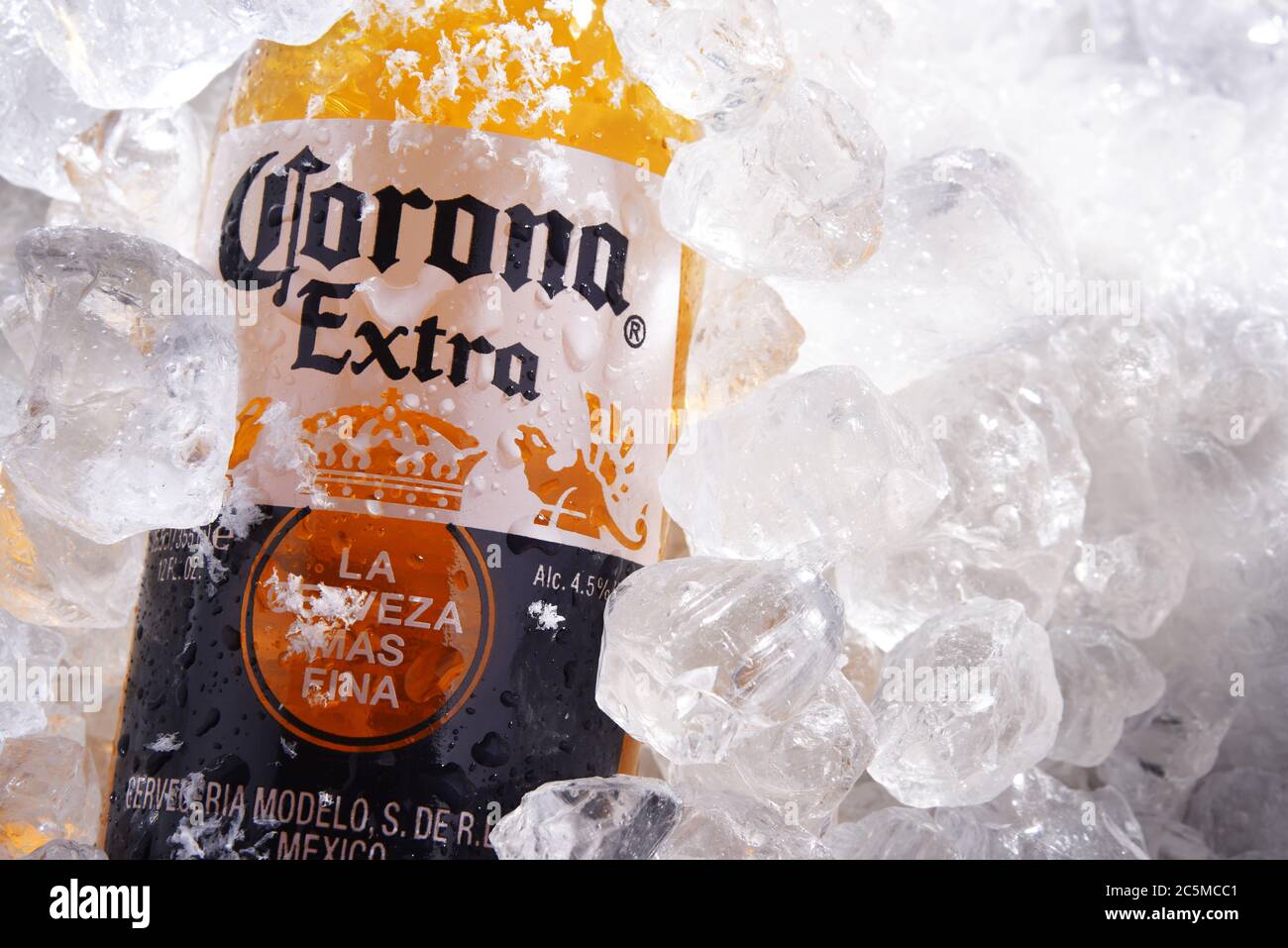 POZNAN, POL - MAY 22, 2020: Bottle of Corona Extra, one of the top-selling beers worldwide, a pale lager produced by Cerveceria Modelo in Mexico Stock Photo