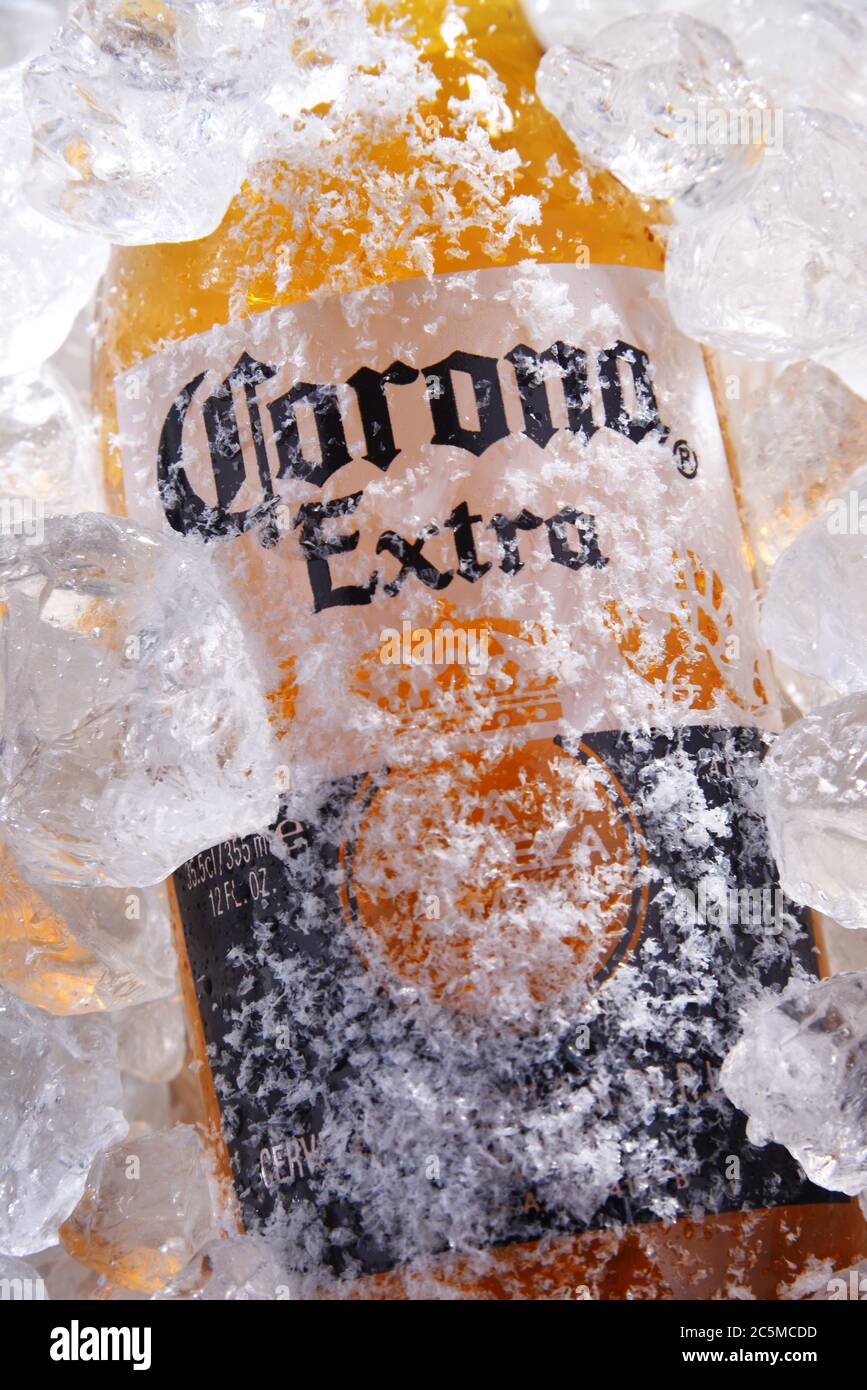 POZNAN, POL - MAY 22, 2020: Bottle of Corona Extra, one of the top-selling beers worldwide, a pale lager produced by Cerveceria Modelo in Mexico Stock Photo