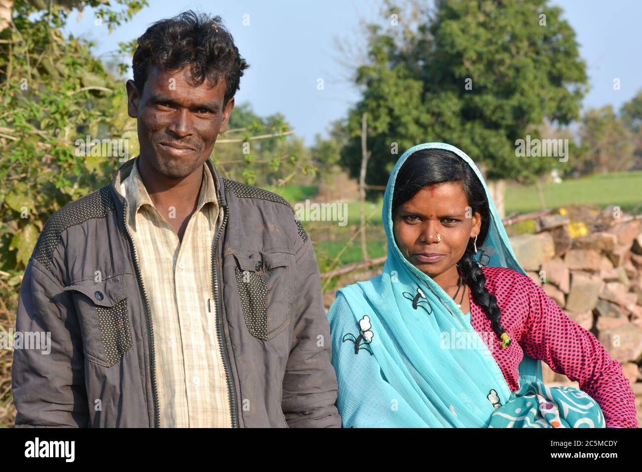 TIKAMGARH, MADHYA PRADESH, INDIA - FEBRUARY 08, 2020: Young indian village man and woman couple smiling and looking at the camera. Stock Photo