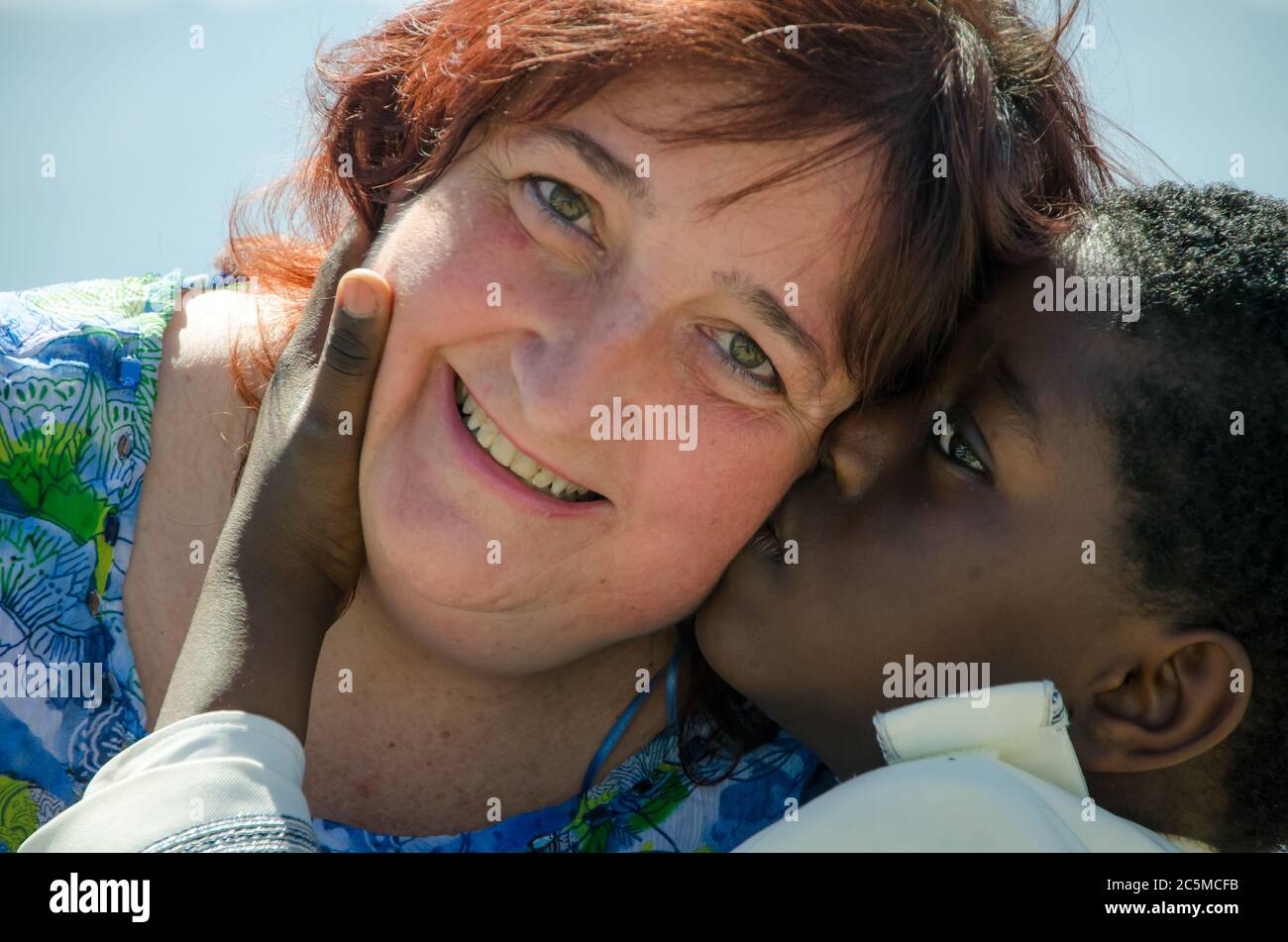 Single, diverse and multiracial family of white mother and black son Stock Photo