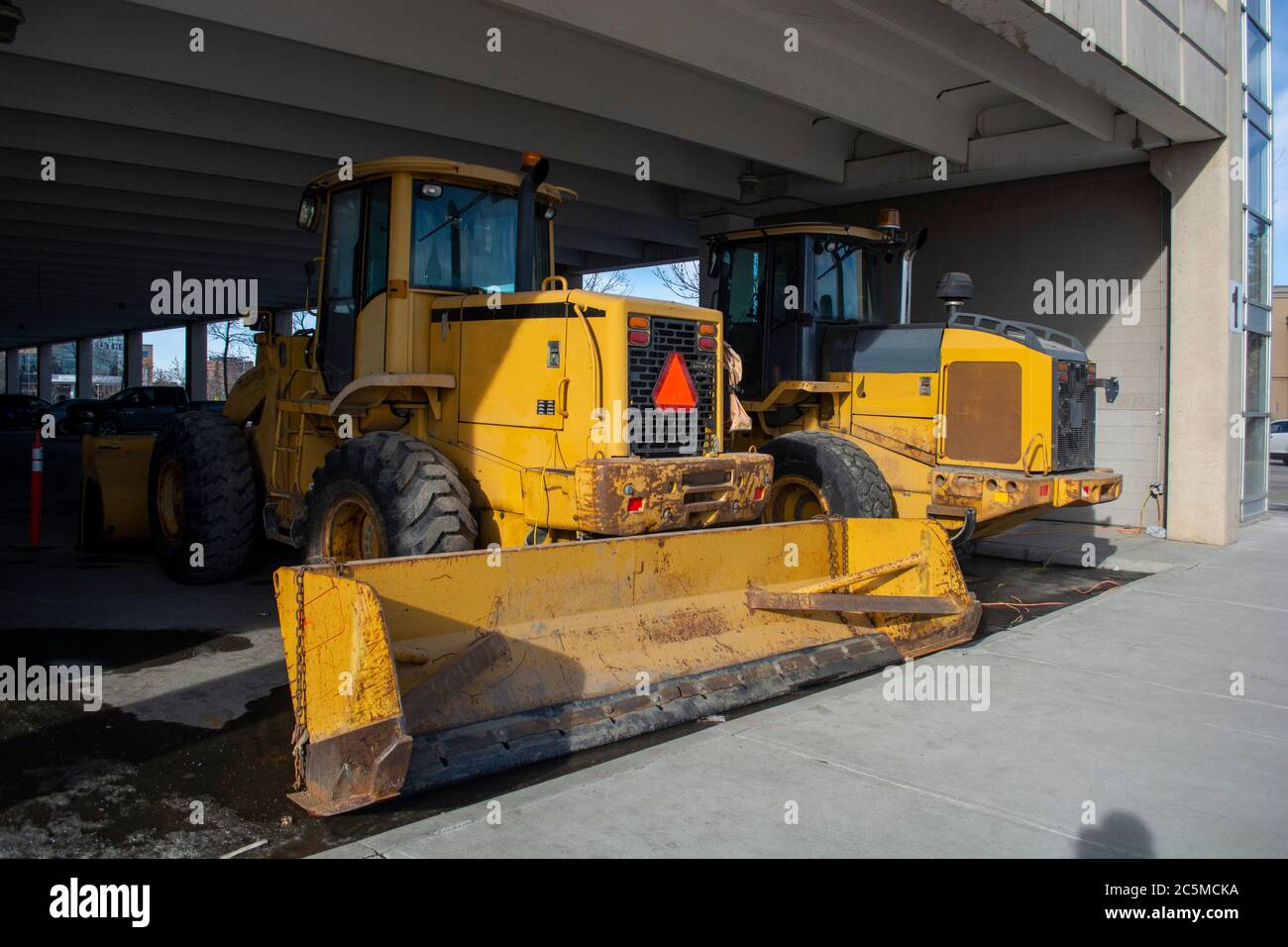 Snow Removal Plow and Wheel Loader in CIty Parkade Stock Photo Alamy