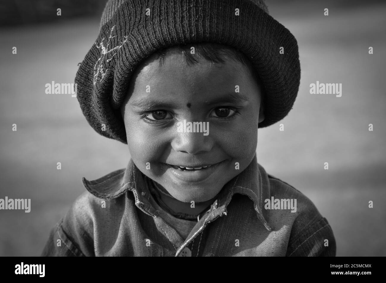TIKAMGARH, MADHYA PRADESH, INDIA - FEBRUARY 11, 2020: Portrait of a little boy in black and white. Stock Photo