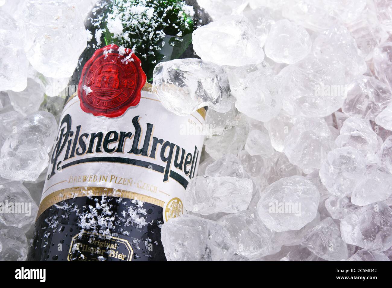 POZNAN, POL - MAY 28, 2020: Bottles of Plzensky Prazdroj, the first pilsner beer in the world, known better by its German name Pilsner Urquell Stock Photo