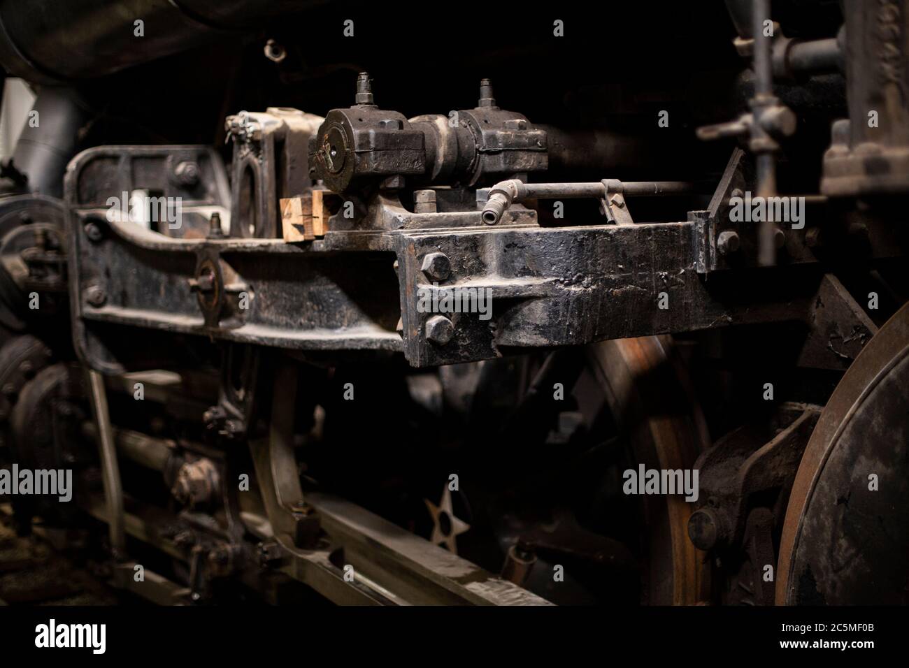 Rusty old valves, gauges and metal parts on an antique steam locomotive