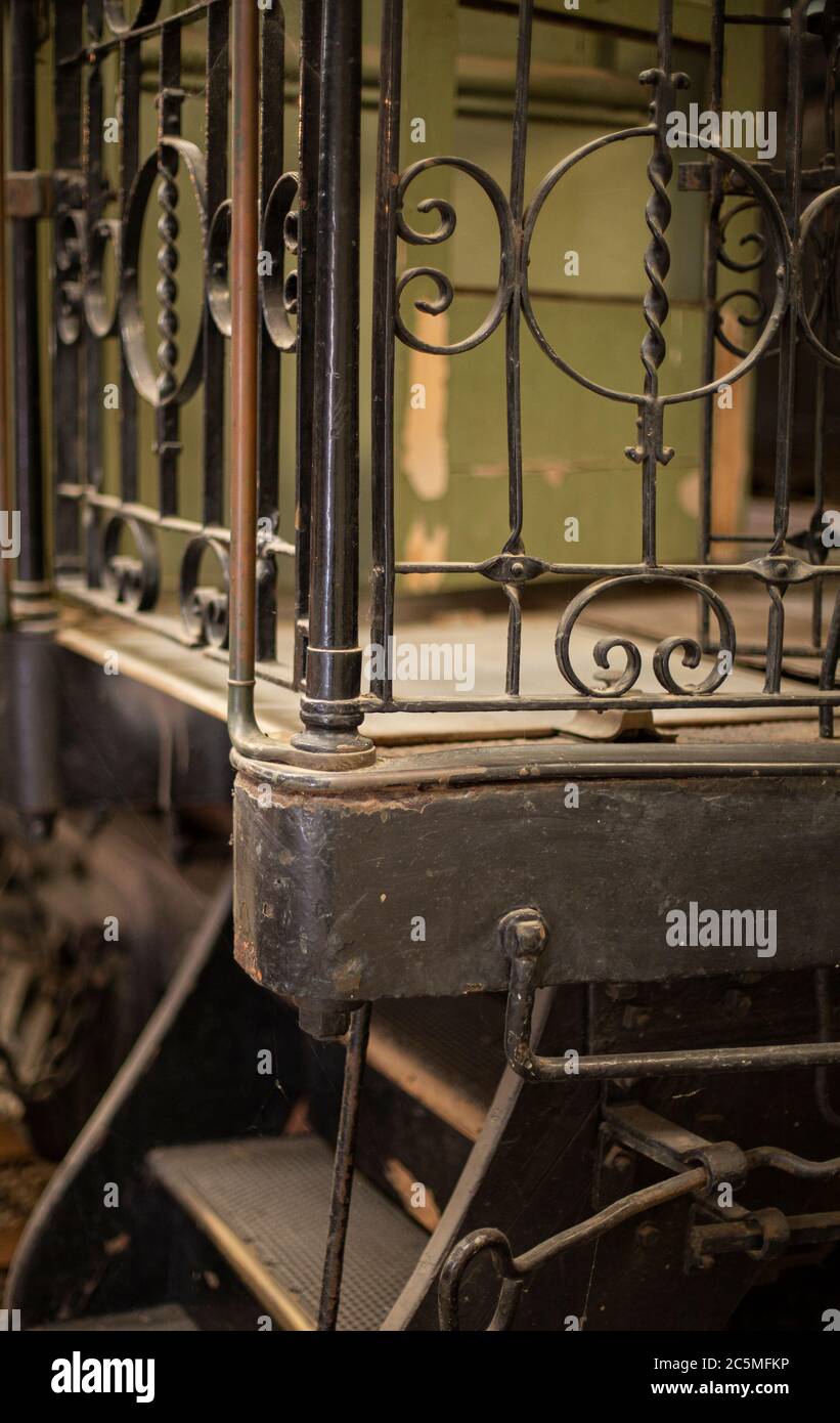 Rusty old valves, gauges and metal parts on an antique steam locomotive ...