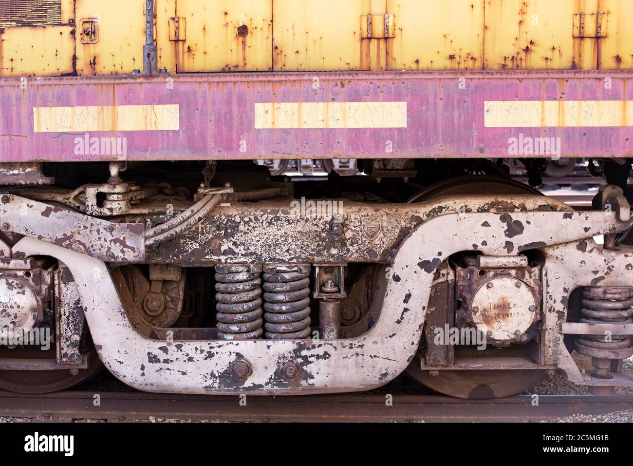 Rusty old valves, gauges and metal parts on an antique steam locomotive ...