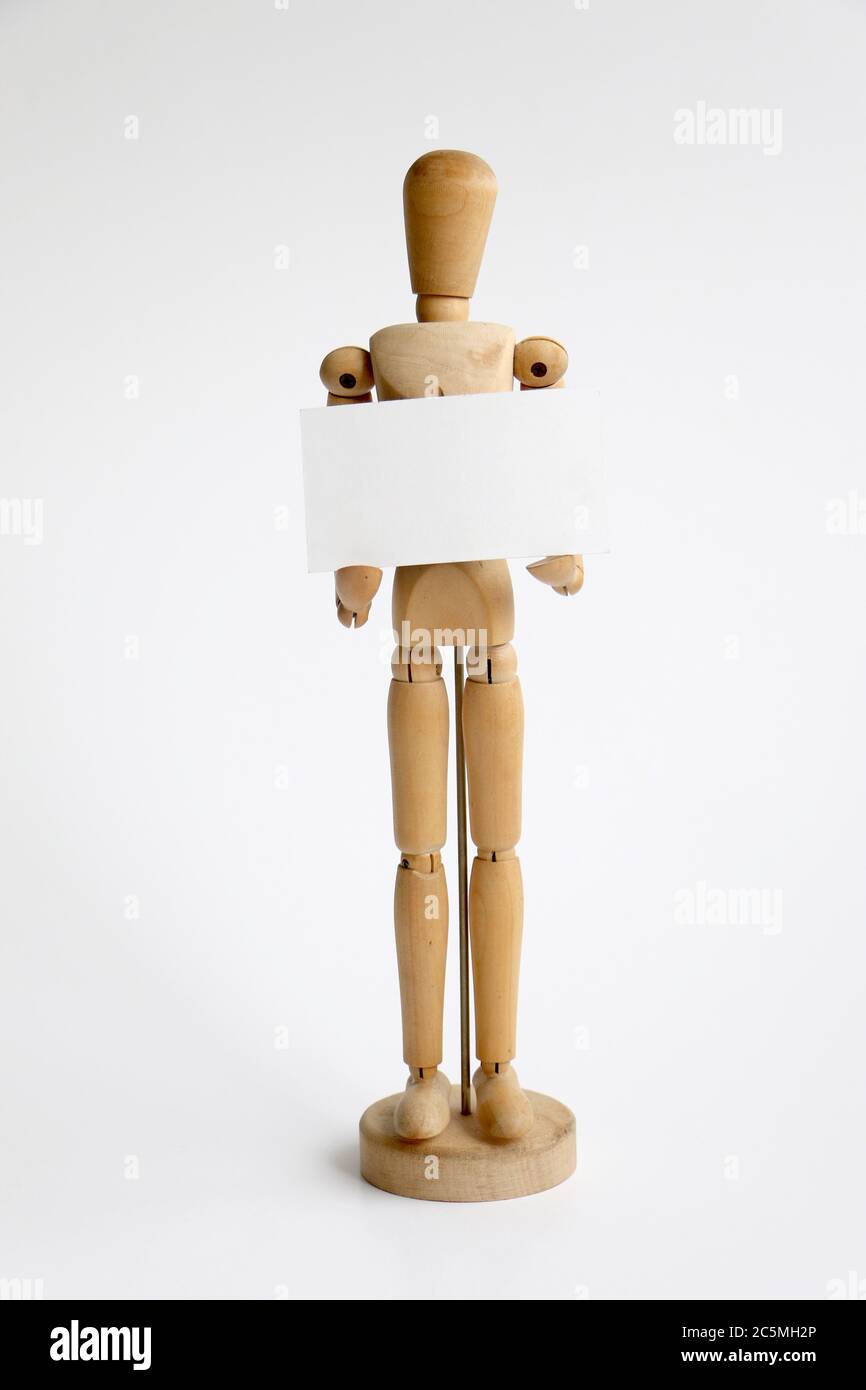 isolated wood mannequin holding a blank sign Stock Photo