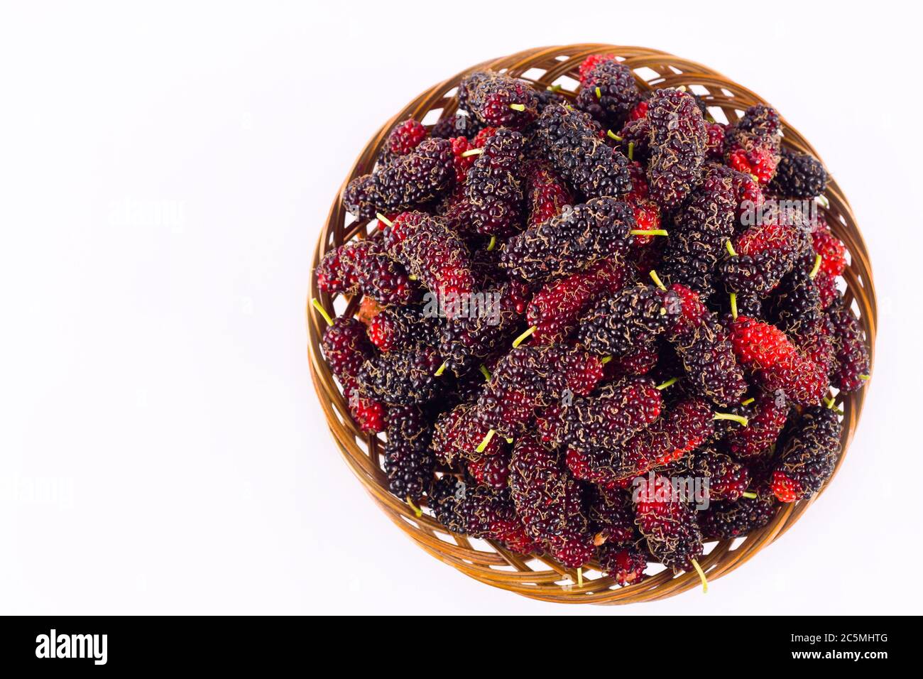 Mulberry is a plant in the family Berry.  Whiich it is on white background healthy mulberry fruit food isolated Stock Photo