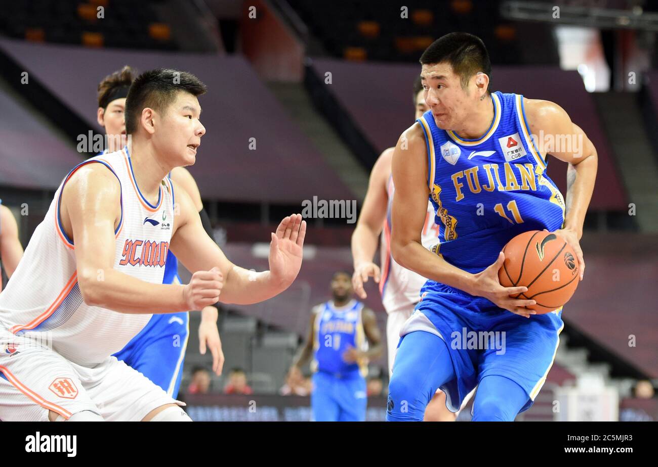 Dongguan, China's Guangdong Province. 4th July, 2020. He Zhongda of Fujian  Sturgeons controls the ball during