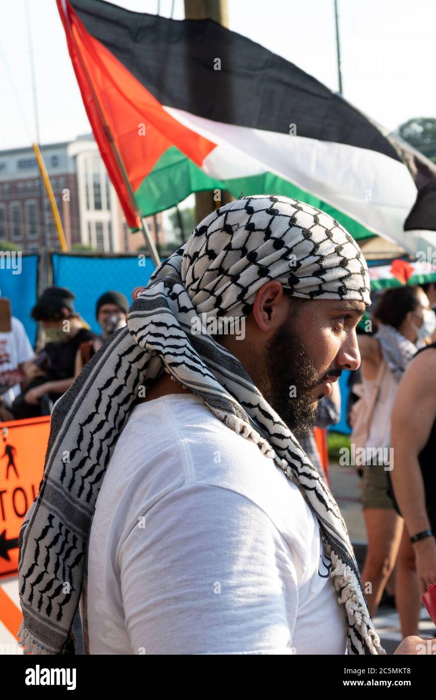 Atlanta, USA. 3rd Jul, 2020. A protester looks off while at a protest on Spring Street in Atlanta, USA, to protest the illegal annexation of Palestinian land. Credit: Micah Casella/Alamy Live News. Stock Photo