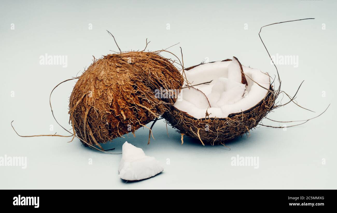 Parts of coconut on a colored background. Close up. Fresh ripe coconut ...