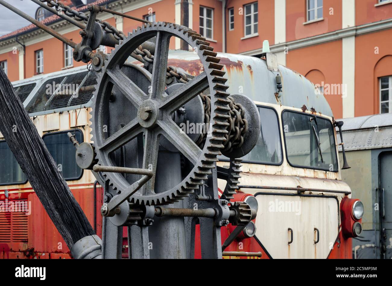 19th century iron crane with chain and winch in the station of Torino Ponte Mosca (Italy), repair workshop for old trains Stock Photo