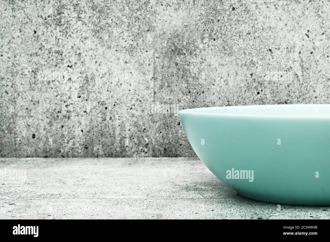 Deep plate on a light background. Glass dishes for the kitchen. close up. Stock Photo