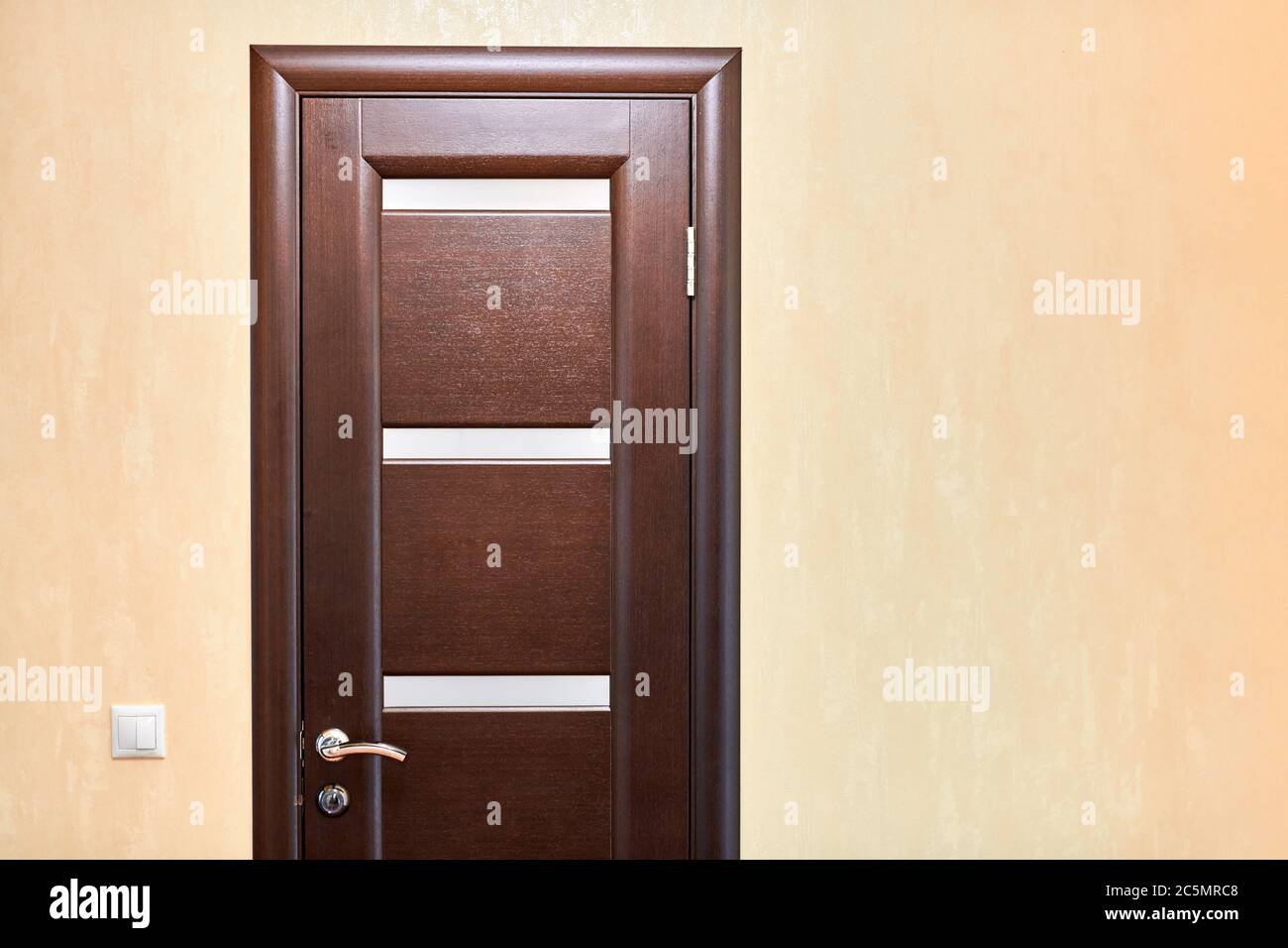 Wooden door in room, copy space. Closed interior door. Entrance to hotel  apartment Stock Photo - Alamy