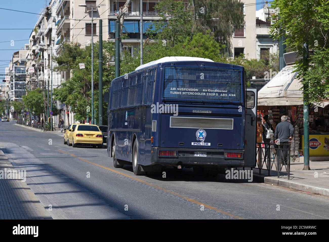 Athens, Greece - April 29 2019: Bus of the Hellenic Police parked near a town square in the city center. Stock Photo