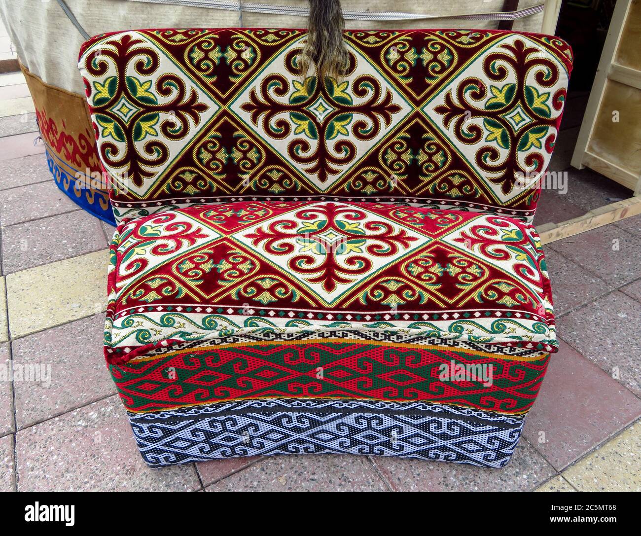 Kazakh ethnic sofa near yurt in Almaty, Kazakhstan Stock Photo