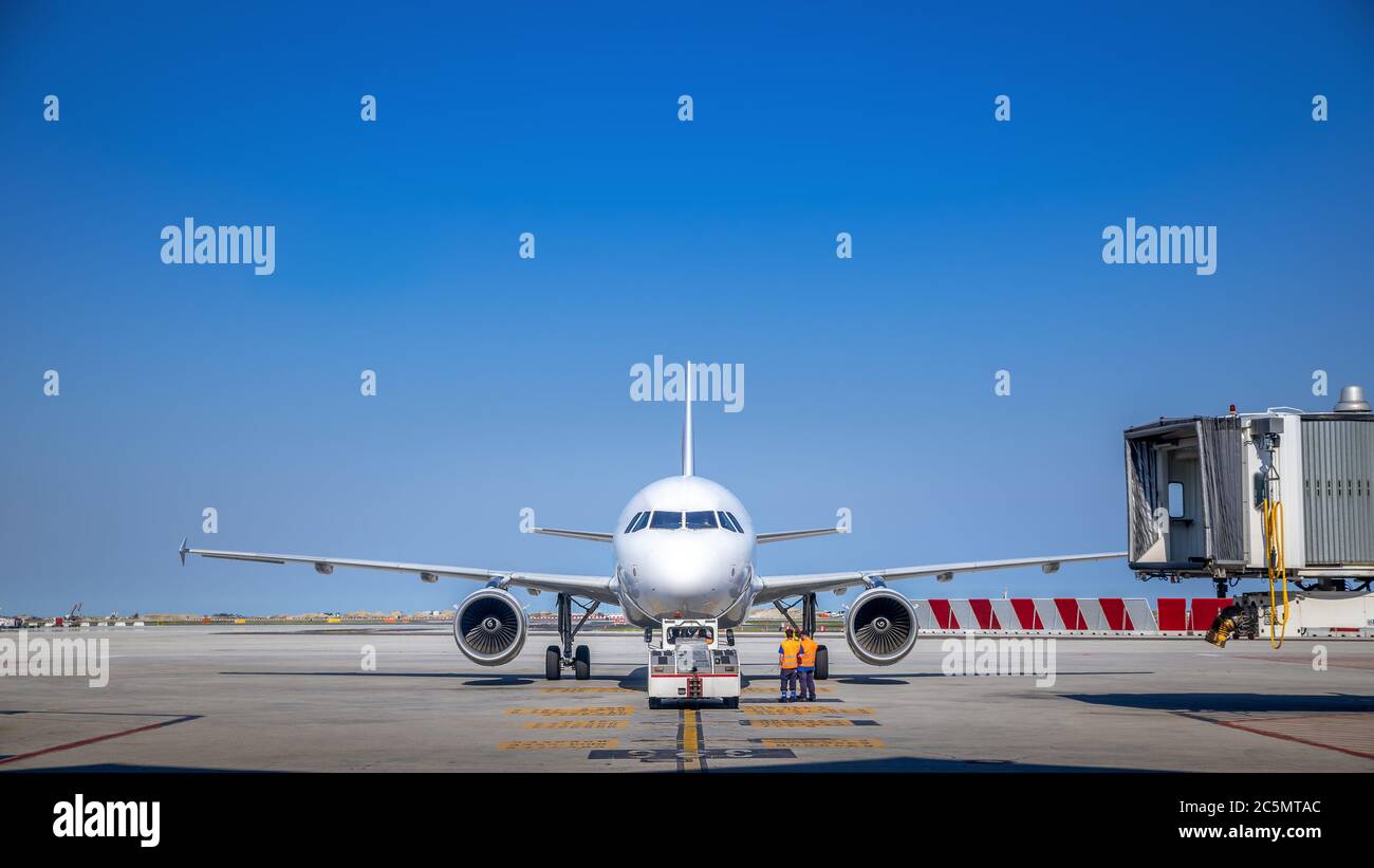 airliner gets service at an airfield Stock Photo