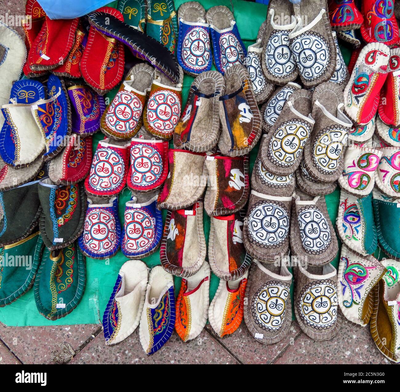 ALMATY, KAZAKHSTAN - MARCH 26, 2017: Traditional wool ethnic slippers on street market in Almaty, Kazakhstan  Almaty, Kazakhstan - March 26, 2017: Tra Stock Photo