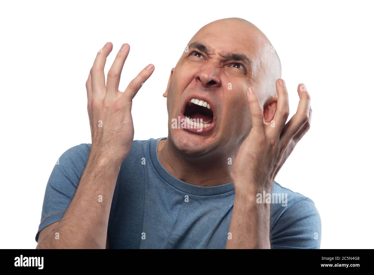 Image of young bald angry screaming man Stock Photo