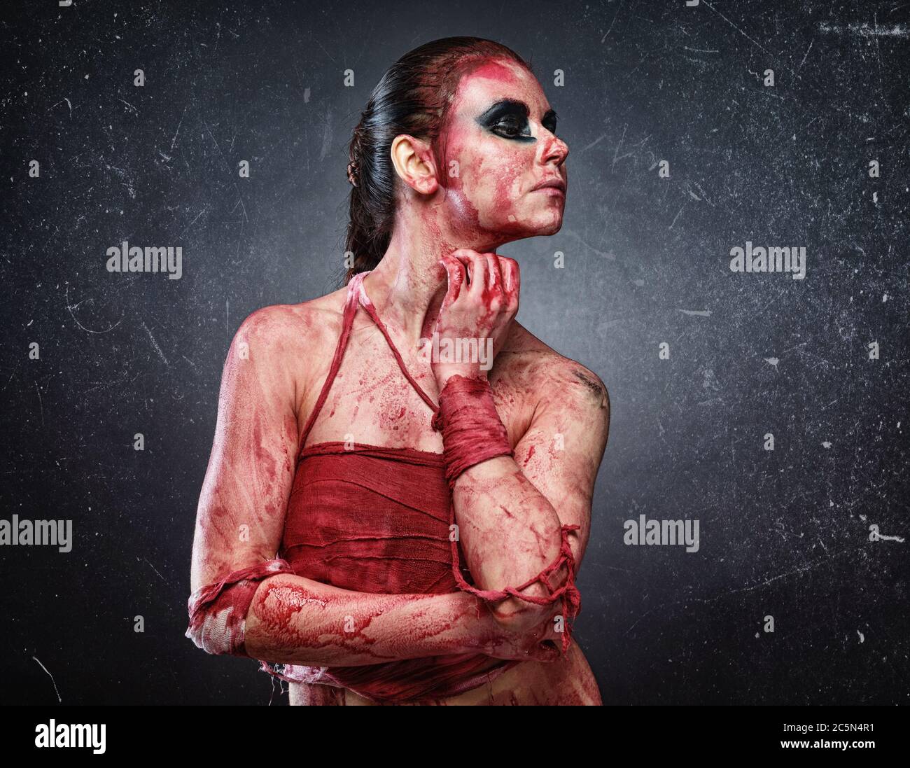 Horror photo of young woman in fake red blood Stock Photo