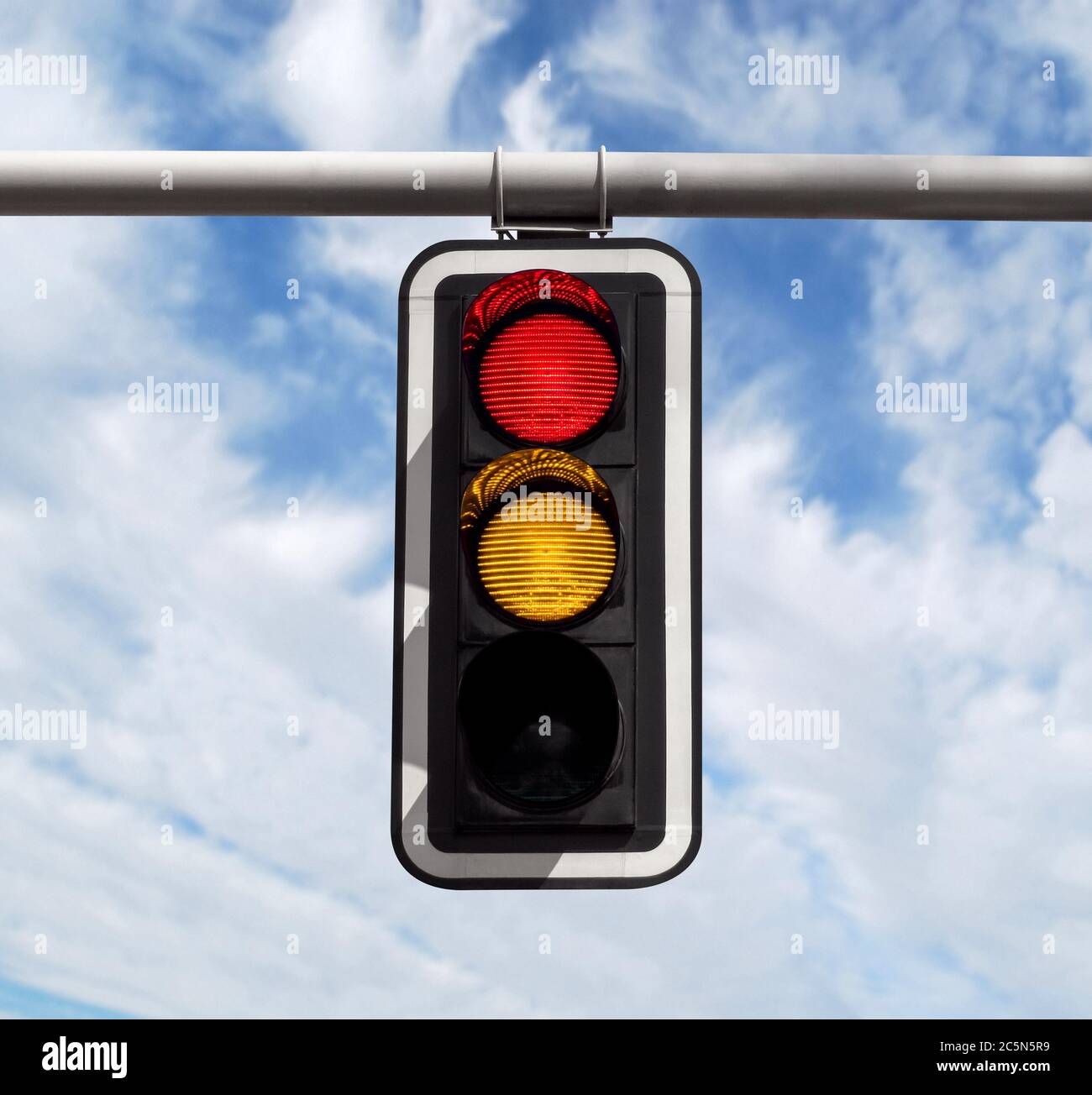 Red-yellow traffic light against blue sky background with Clipping Path ...