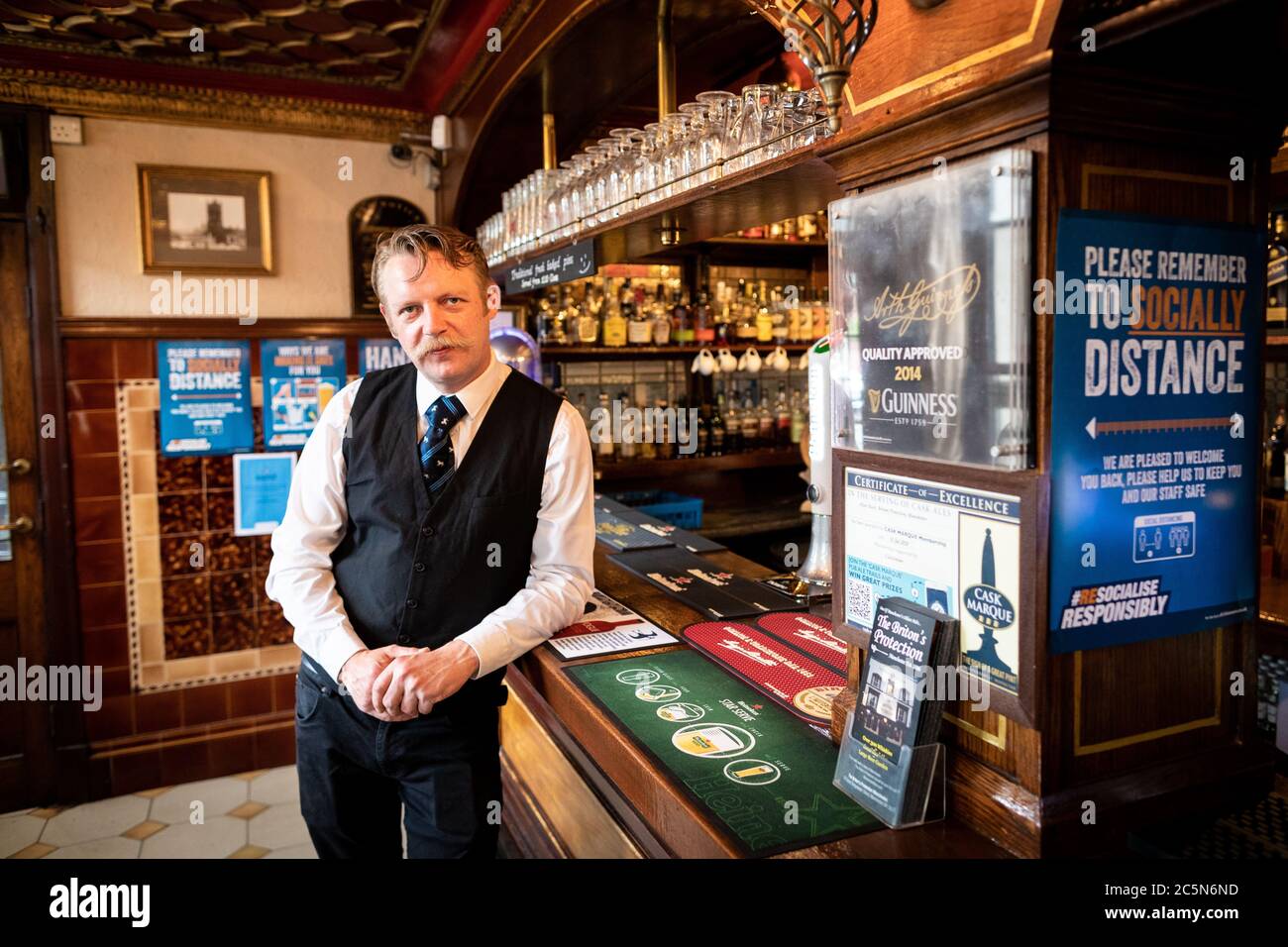 Manchester, UK. 04th July, 2020. The manager, Tor Sagan, stands in the The Britons Protection pub ahead of what has been dubbed Super Saturday. From this morning, bars and restaurants in England were allowed to open their doors for the first time in three months. Credit: Andy Barton/Alamy Live News Stock Photo