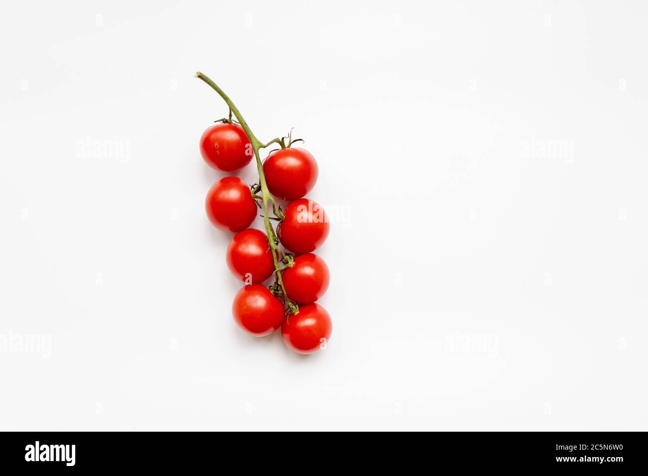 Fresh cherry tomatoes on a white background Stock Photo - Alamy