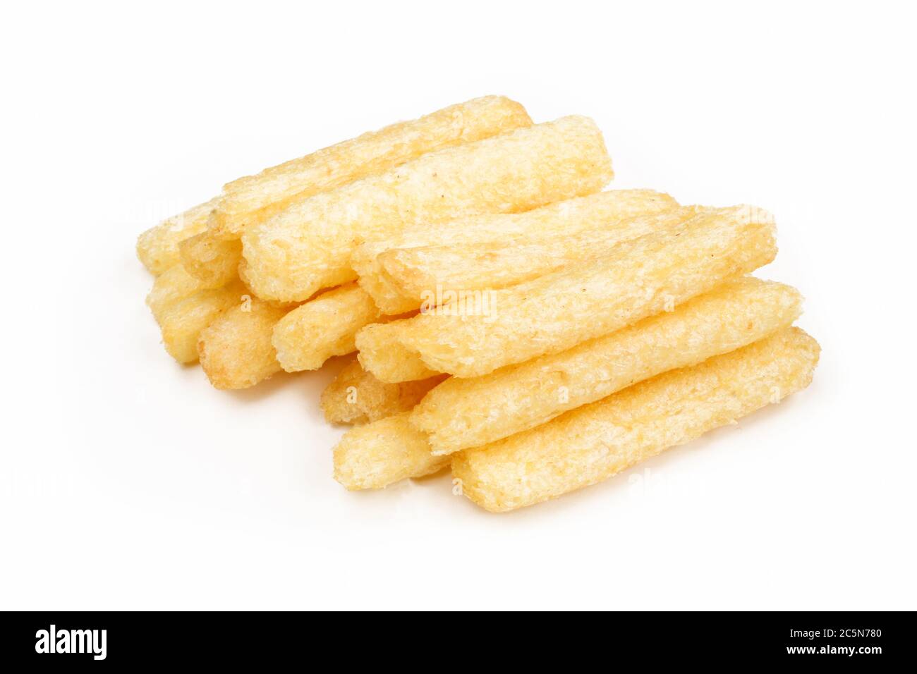 Pile of crispy peanut sticks/fingers snacks isolated on white background. Stock Photo