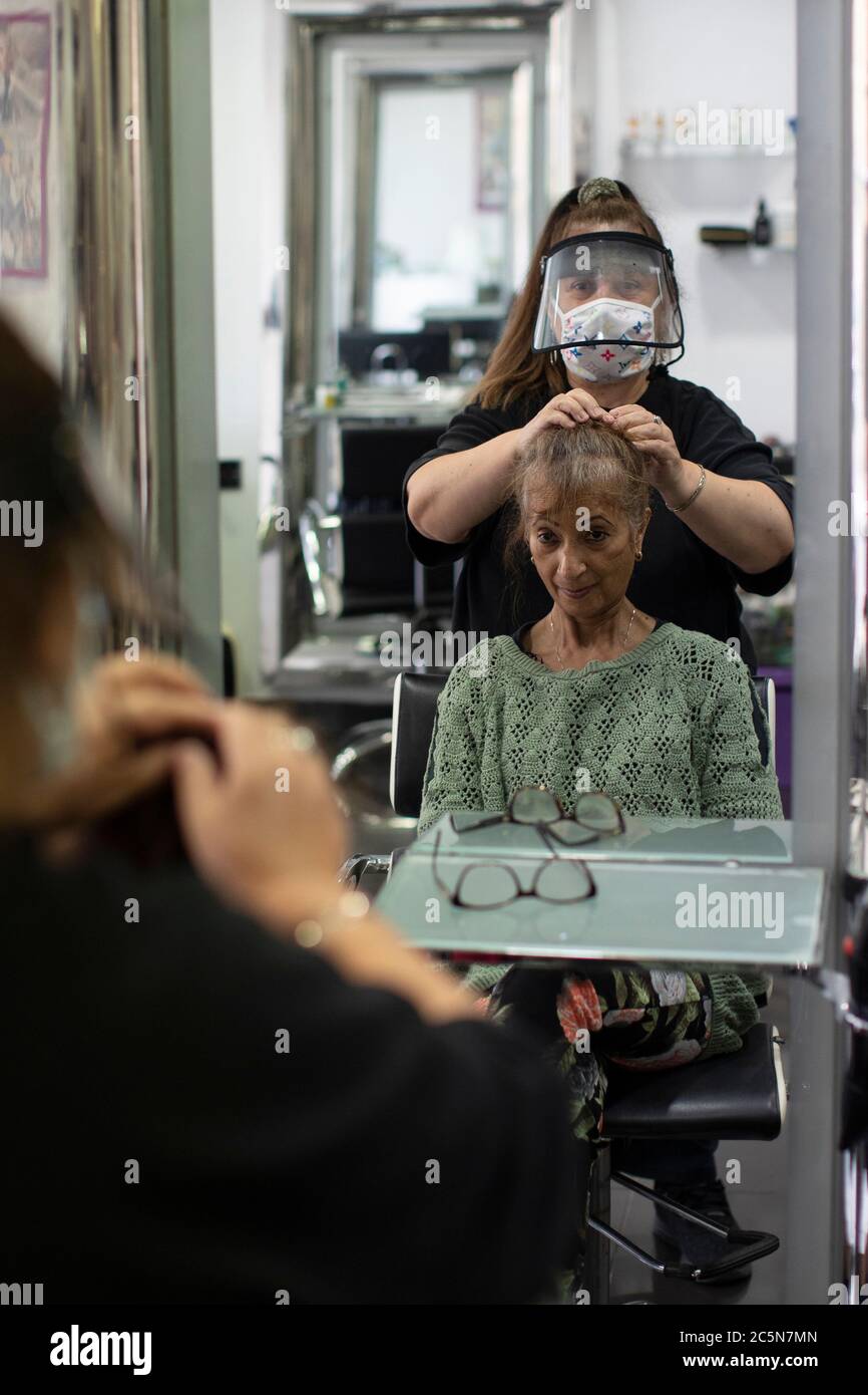 Women having haircut in hair salon hires stock photography and images