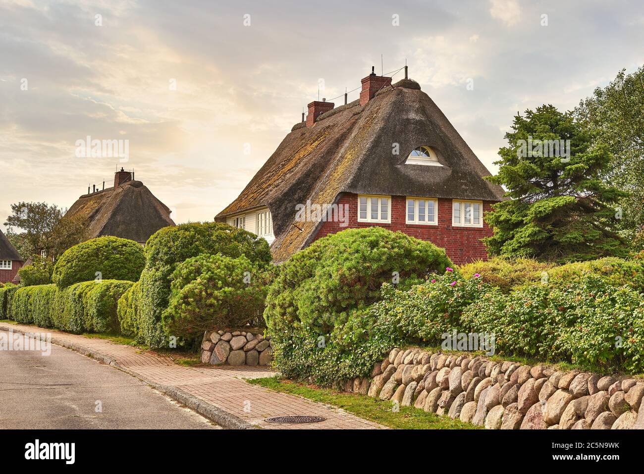 Country house, romantic thatched cottage. Fairytale landscape on the island of Sylt, North Frisian Islands, Germany. Stock Photo