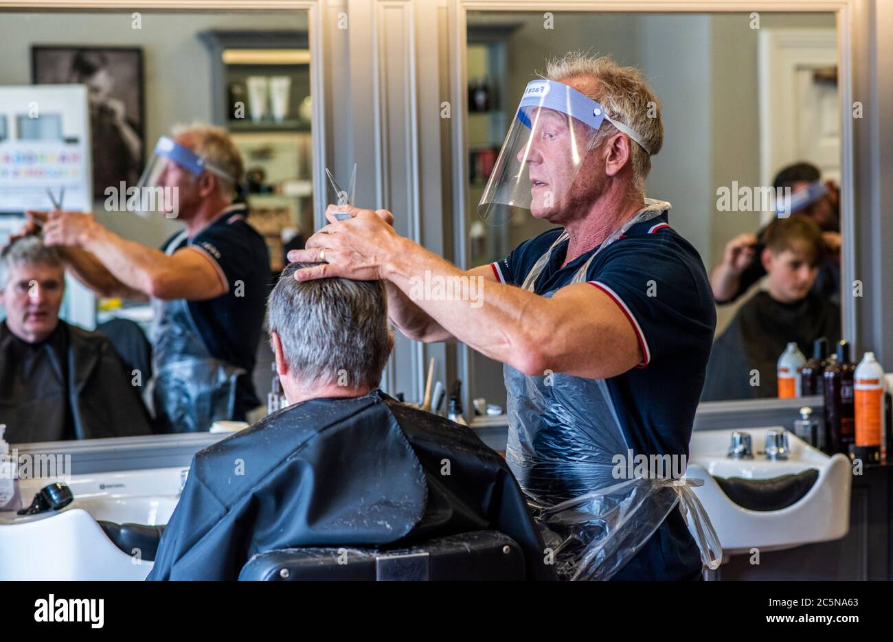 Harrogate, North Yorkshire, UK. 4th July, 2020. David Steca, owner of Steca N.6 barber shop, at