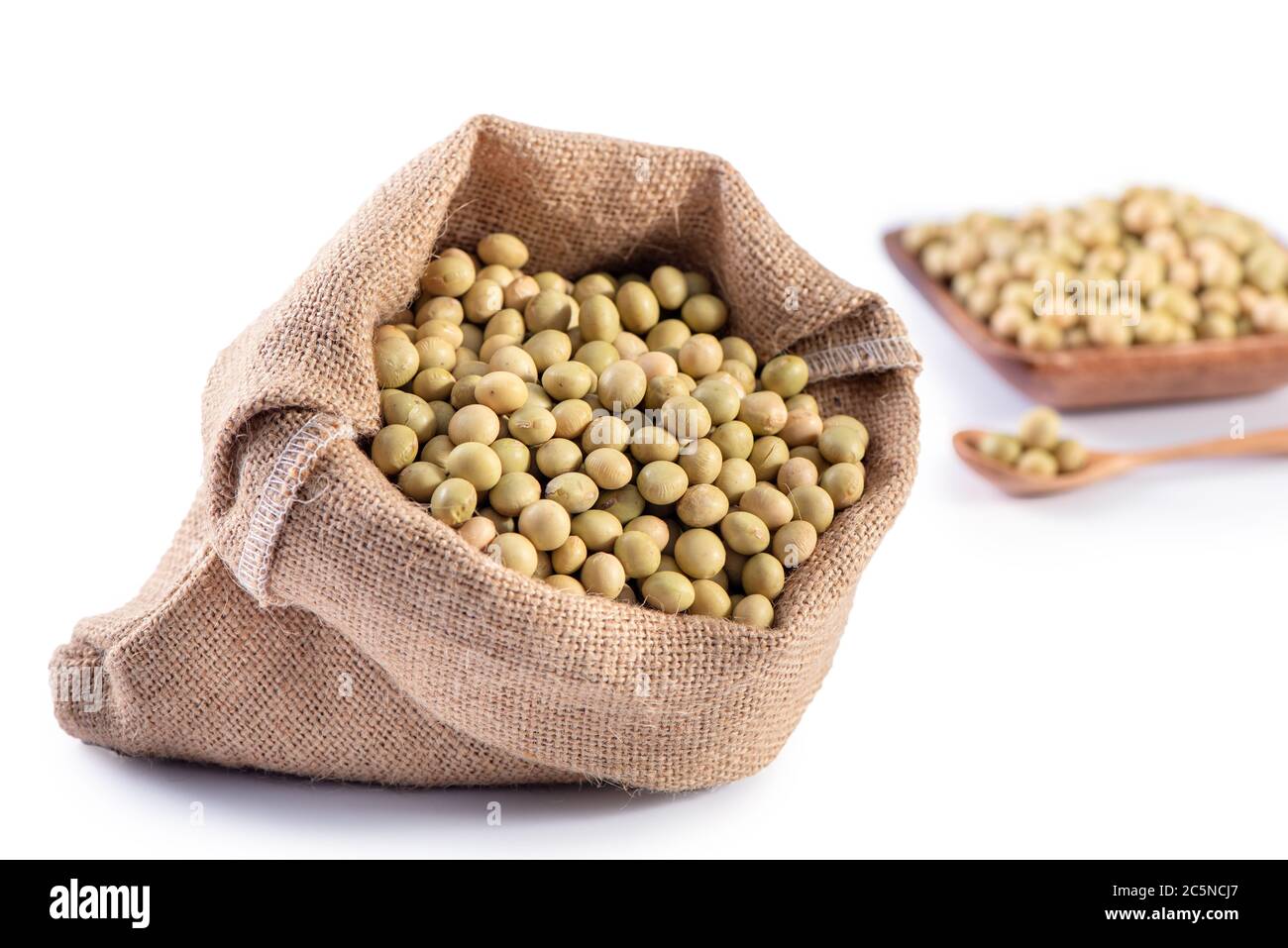 Yellowgreen Taiwanese organic nonGMO soybeans, soy beans in a container isolated on white