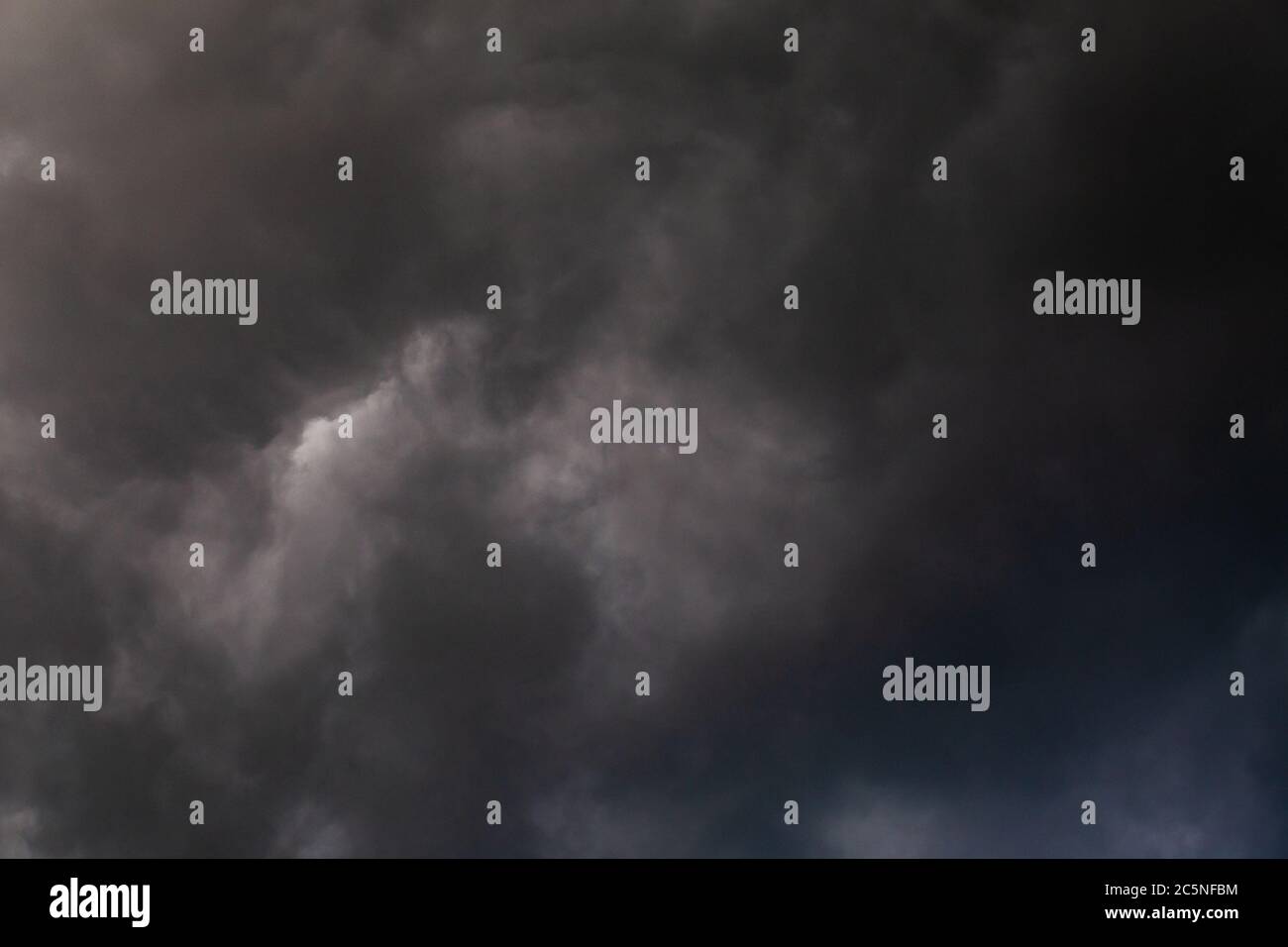 gray incoming storm clouds dark closeup backdrop Stock Photo