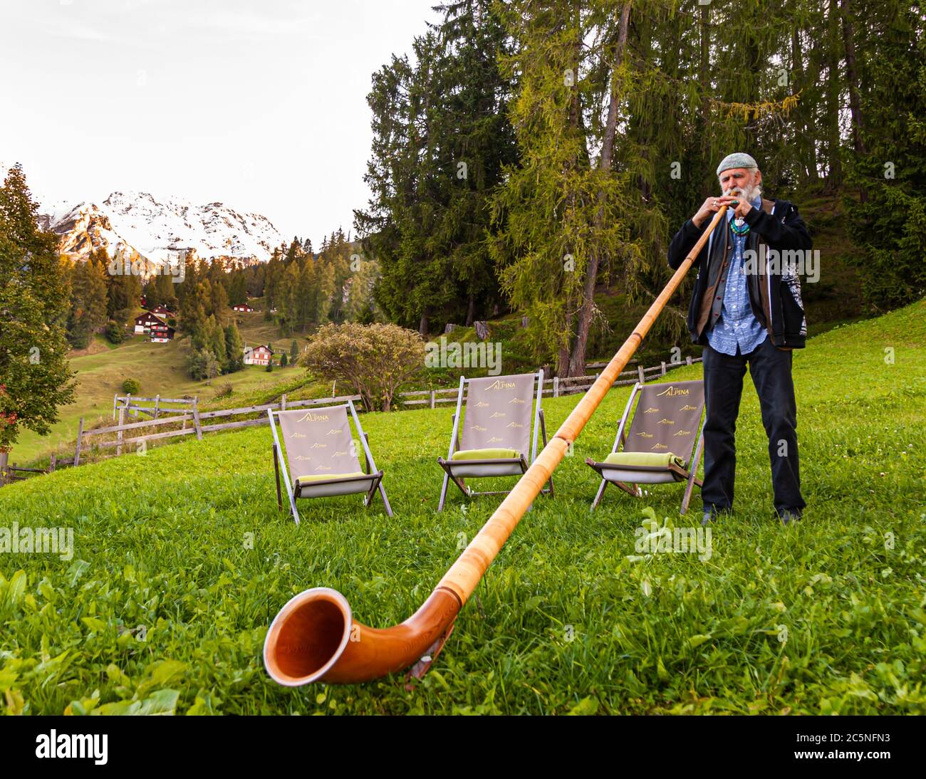 Musician playing the Alphorn in Tschiertschen-Praden, Switzerland Stock Photo