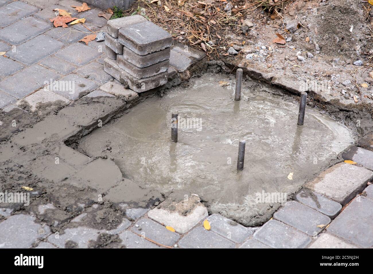 reinforcement sticking out from under the concrete, closeup of the