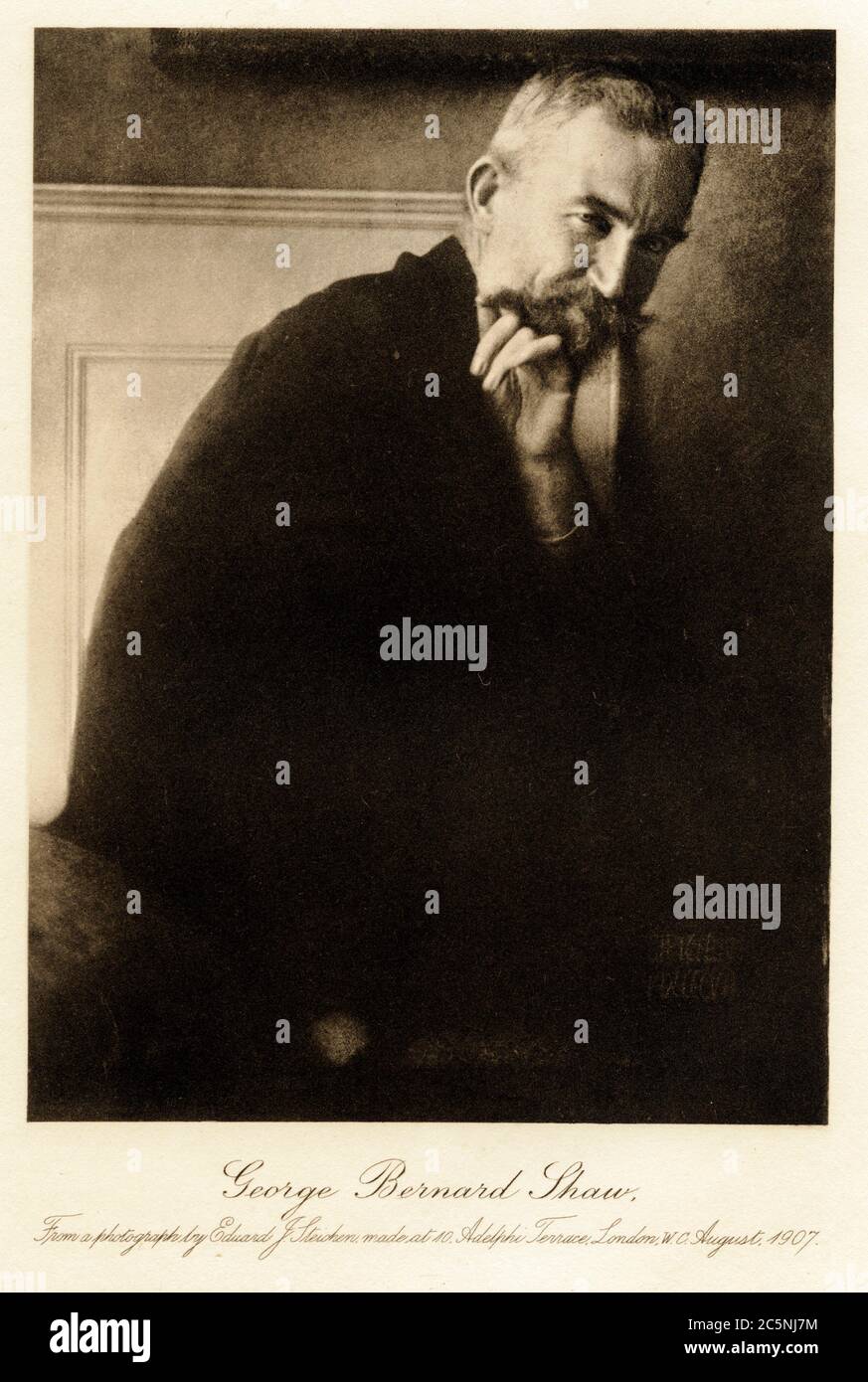 Portrait of Irish playwright, critic and political activist George Bernard Shaw (1856 - 1950) with his chin resting on his hand, 1907. Photogravure by Edward Steichen (1879-1973) Stock Photo