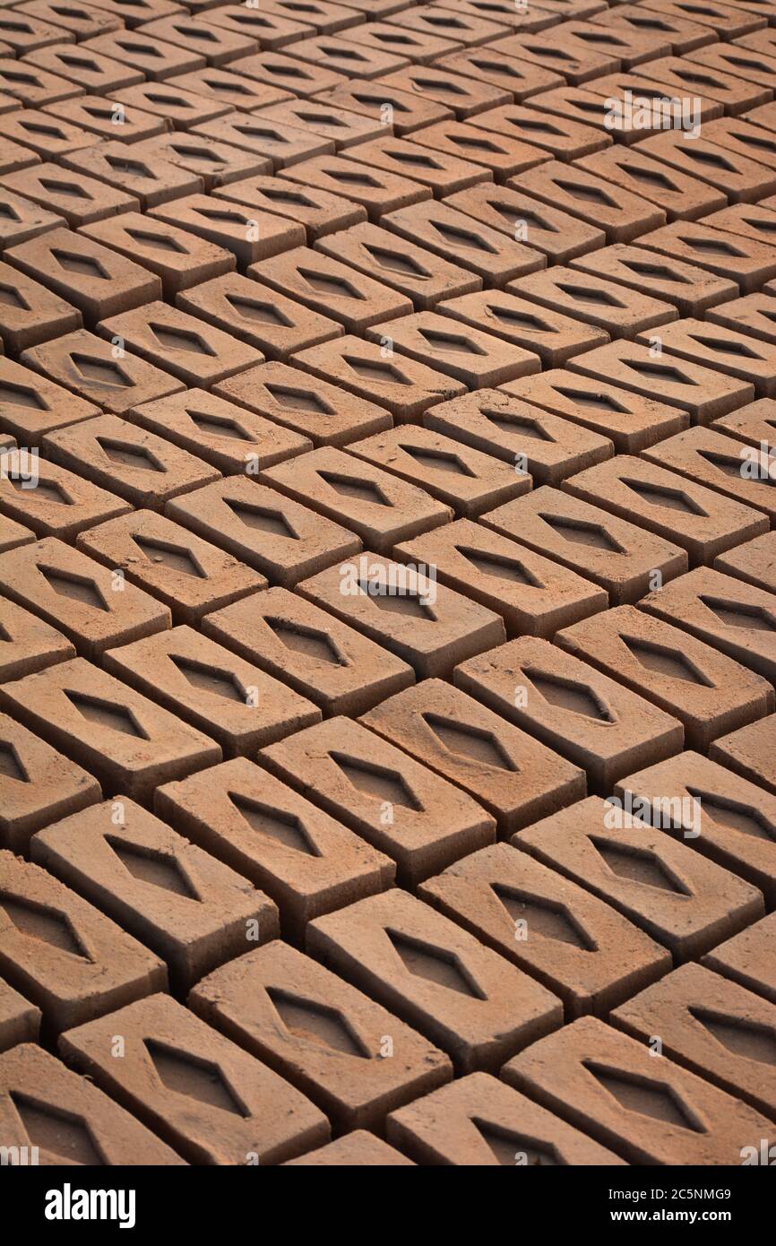 Raw brick laid out in stacks for drying. Bricks in a brick factory