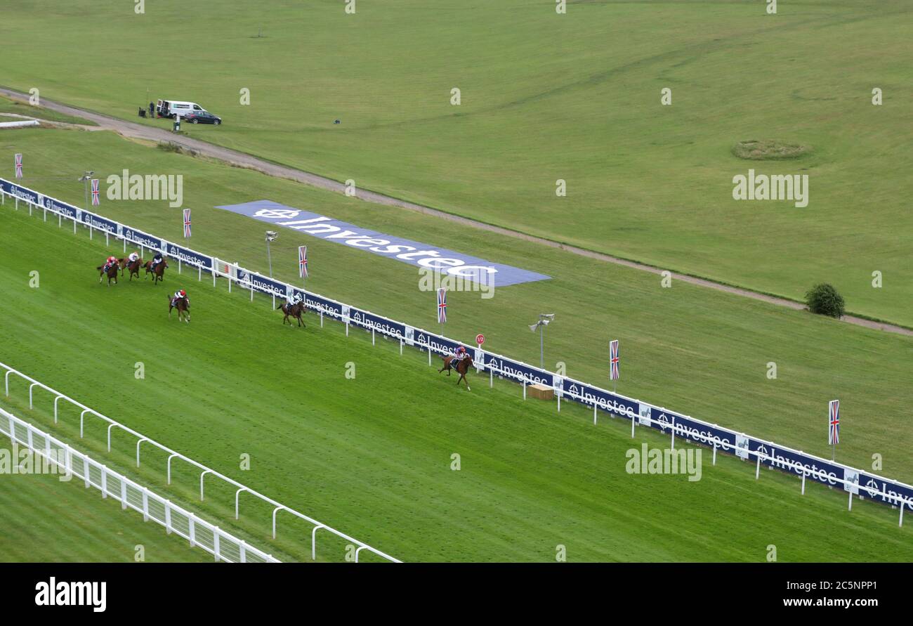 Love ridden by Ryan Moore (right) wins the Investec Oaks at Epsom Racecourse. Stock Photo