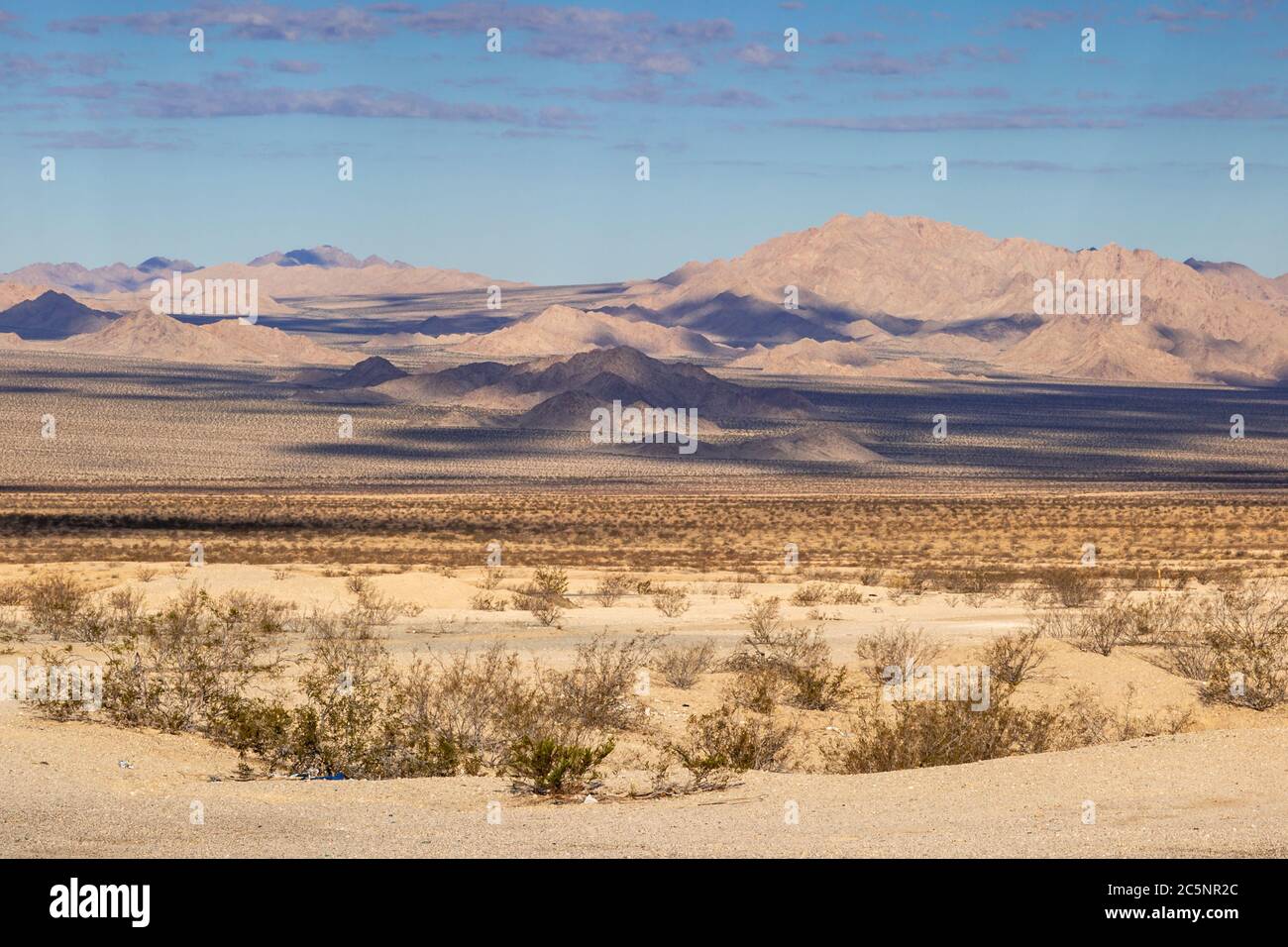 A Californian desert landscape with cloud shadows on the mountains Stock Photo