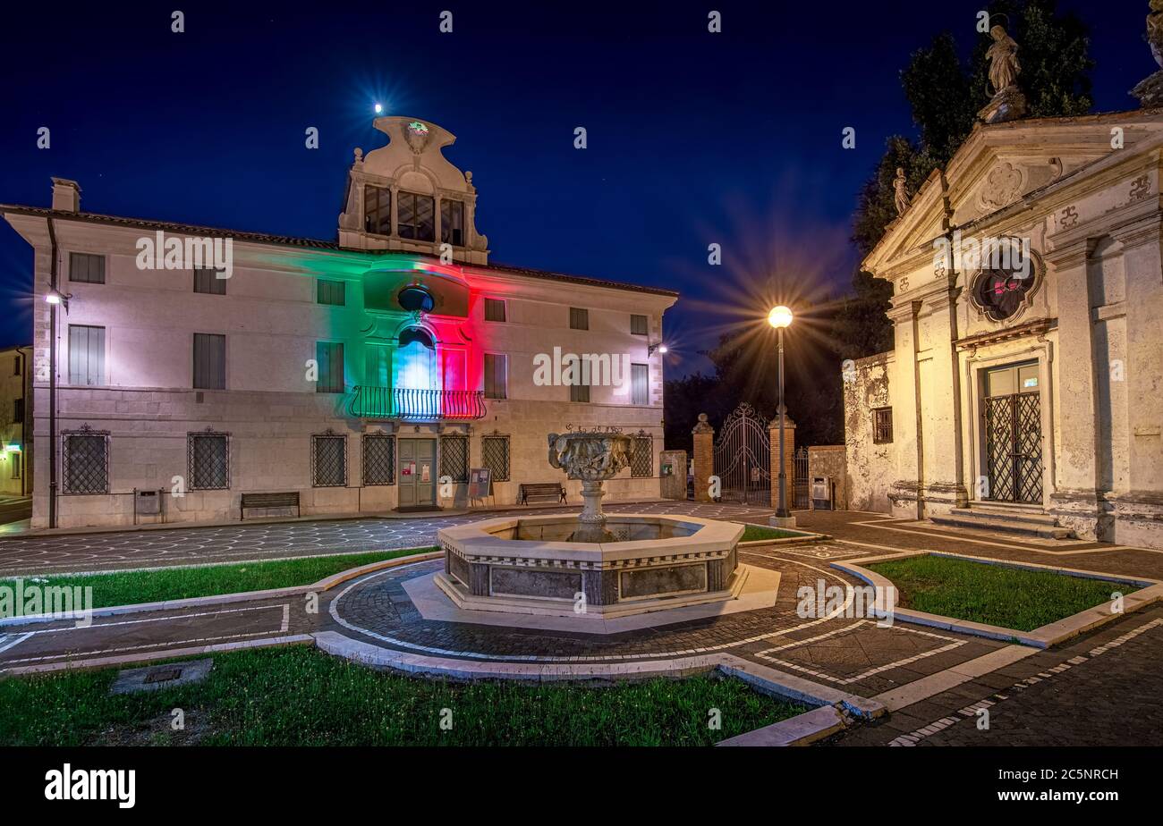 30 july 2020, Casale sul sile (Italy): The library square in Casale sul Sile (italy)  illuminated with italian flag lights for covid 19 pandemic Stock Photo