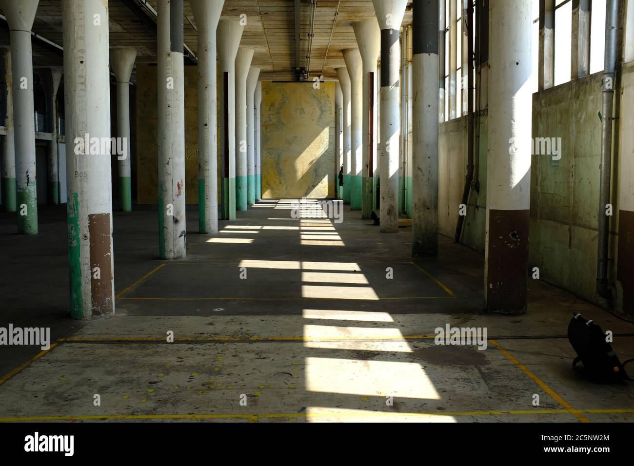 the interior of an abandoned industrial warehouse building on old industrial park called Hembrug in the netherlands Stock Photo