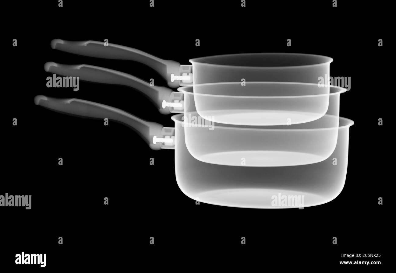 Stack of saucepans, X-ray. Stock Photo