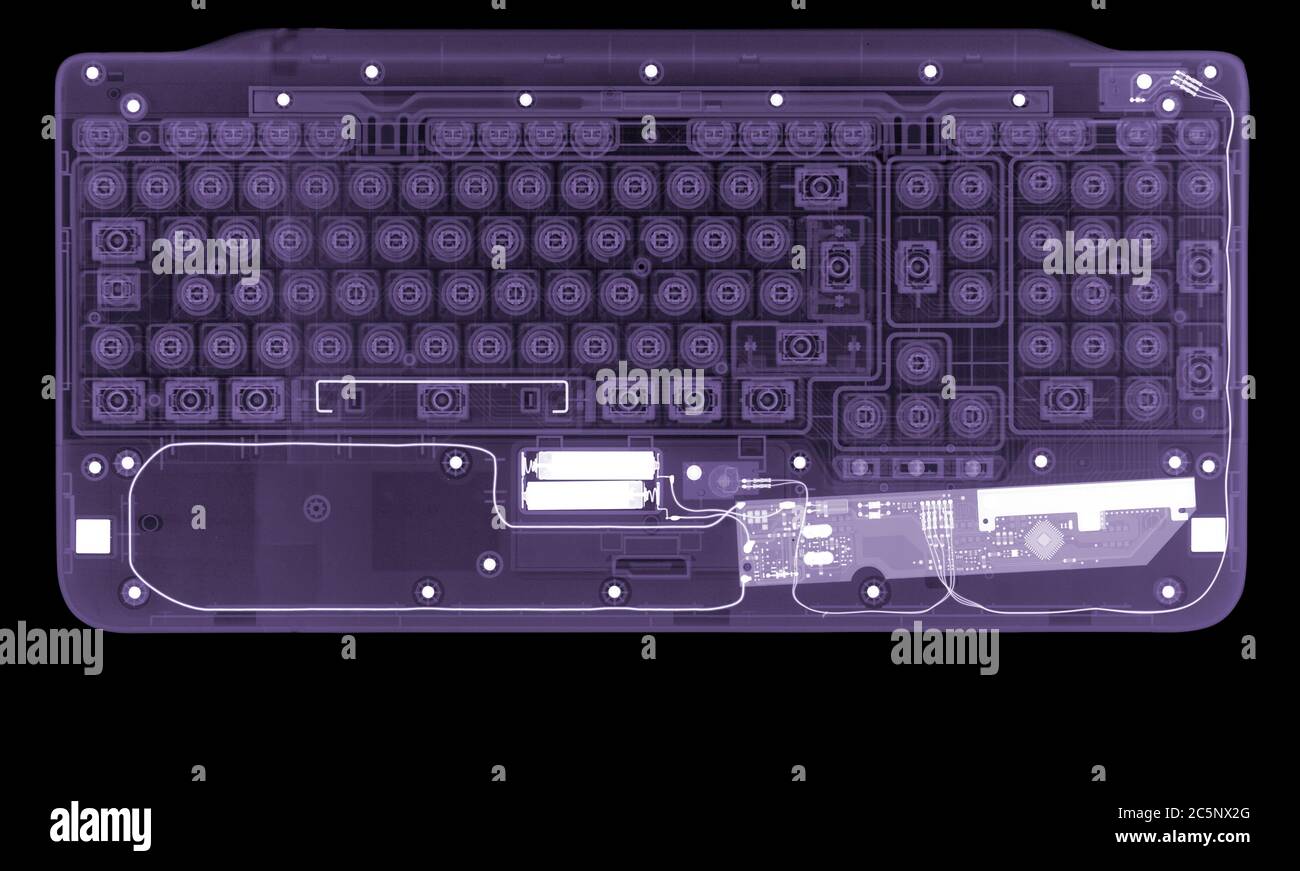 Computer keyboard, coloured X-ray. Stock Photo
