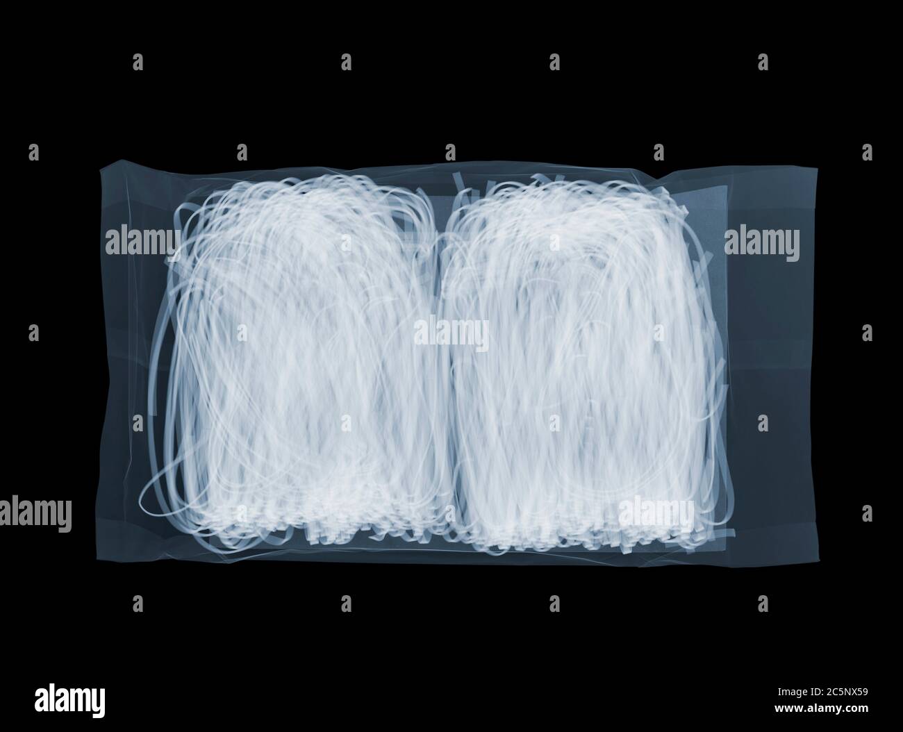 Packet of noodles, coloured X-ray. Stock Photo
