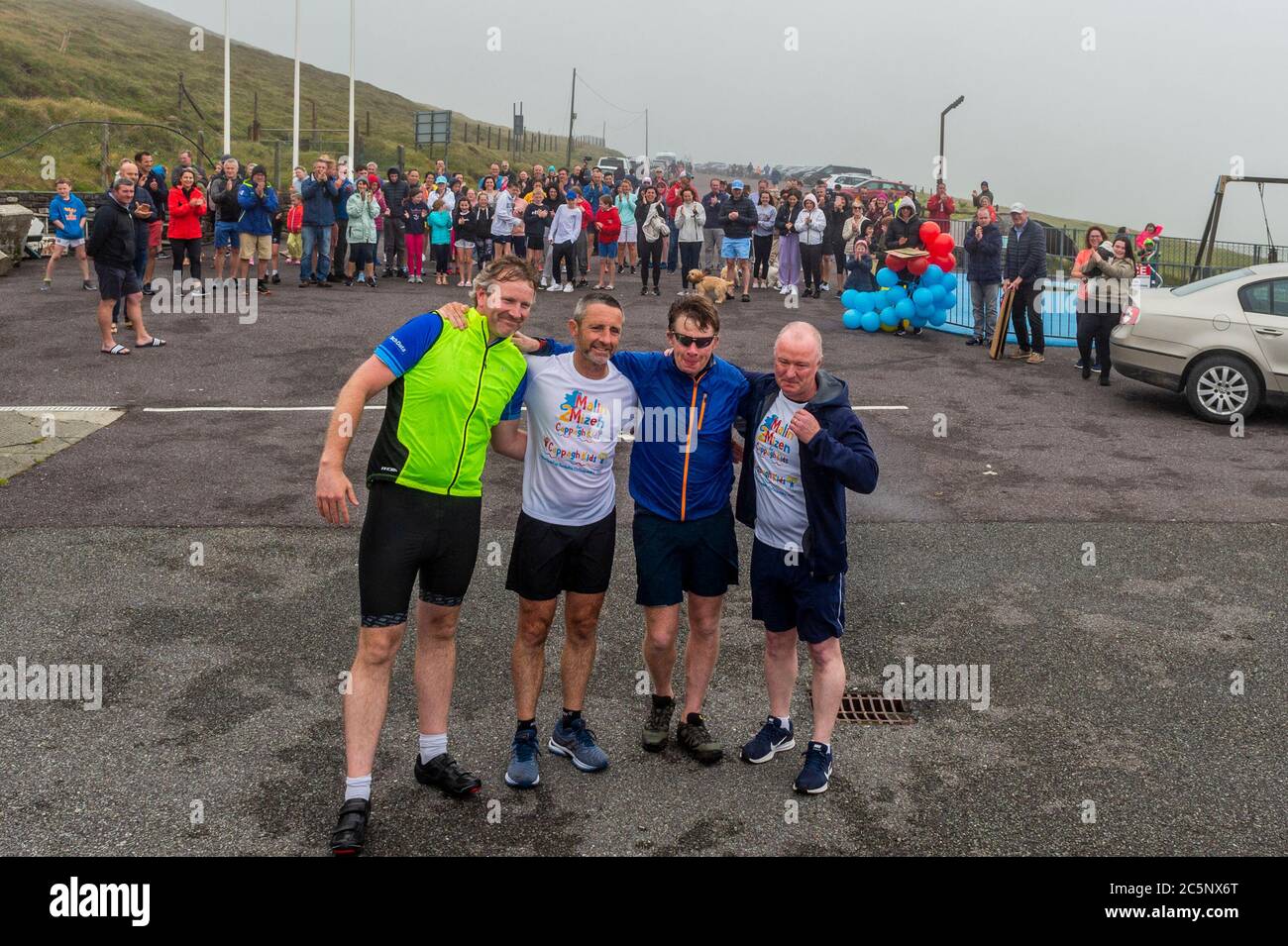 West Cork, Ireland. 4th July, 2020. Barry Sheehan, who lives in Cork, has ran 600 kms from Malin to Mizen Head in aid of the new children's unit 'Cappagh Kids' of National Orthopaedic Hospital, Cappagh, Dublin. Barry is pictured with his support crew after crossing the finish line. Credit: AG News/Alamy Live News Stock Photo