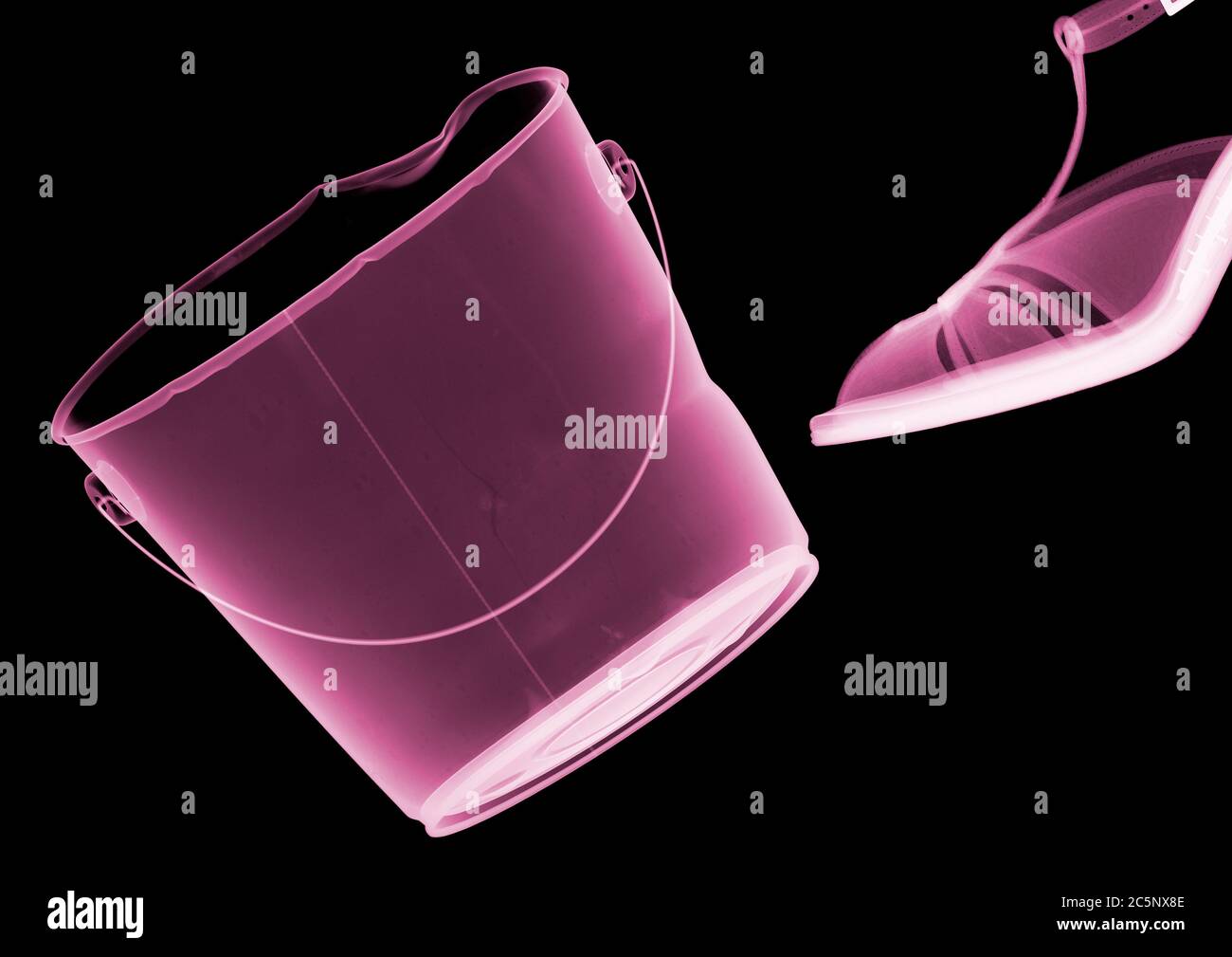 Shoe kicking bucket, coloured X-ray. Stock Photo