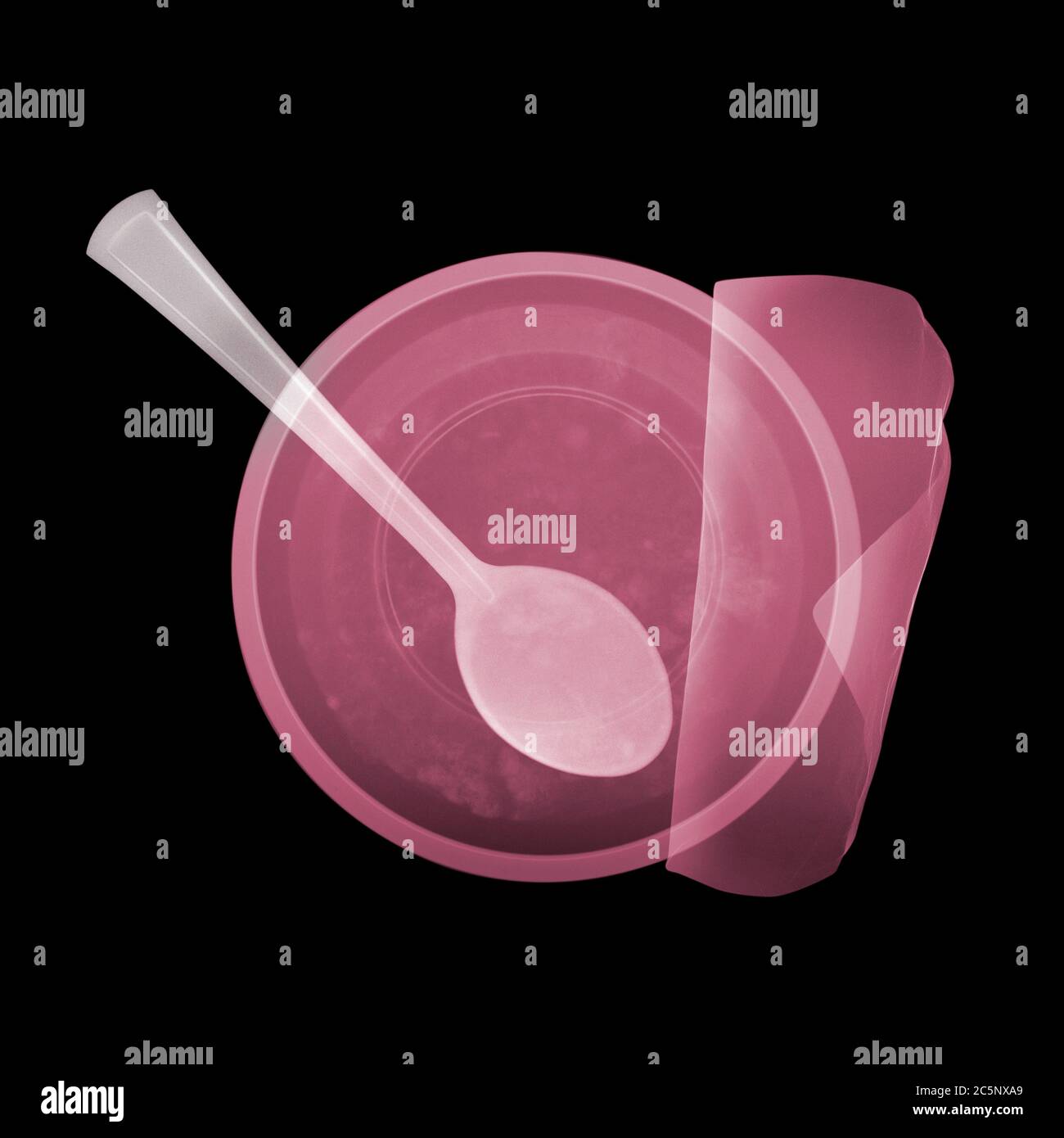 Teaspoon in yoghurt, coloured X-ray. Stock Photo